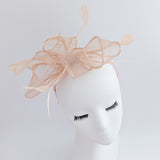 Light peach pink feather fascinator hat