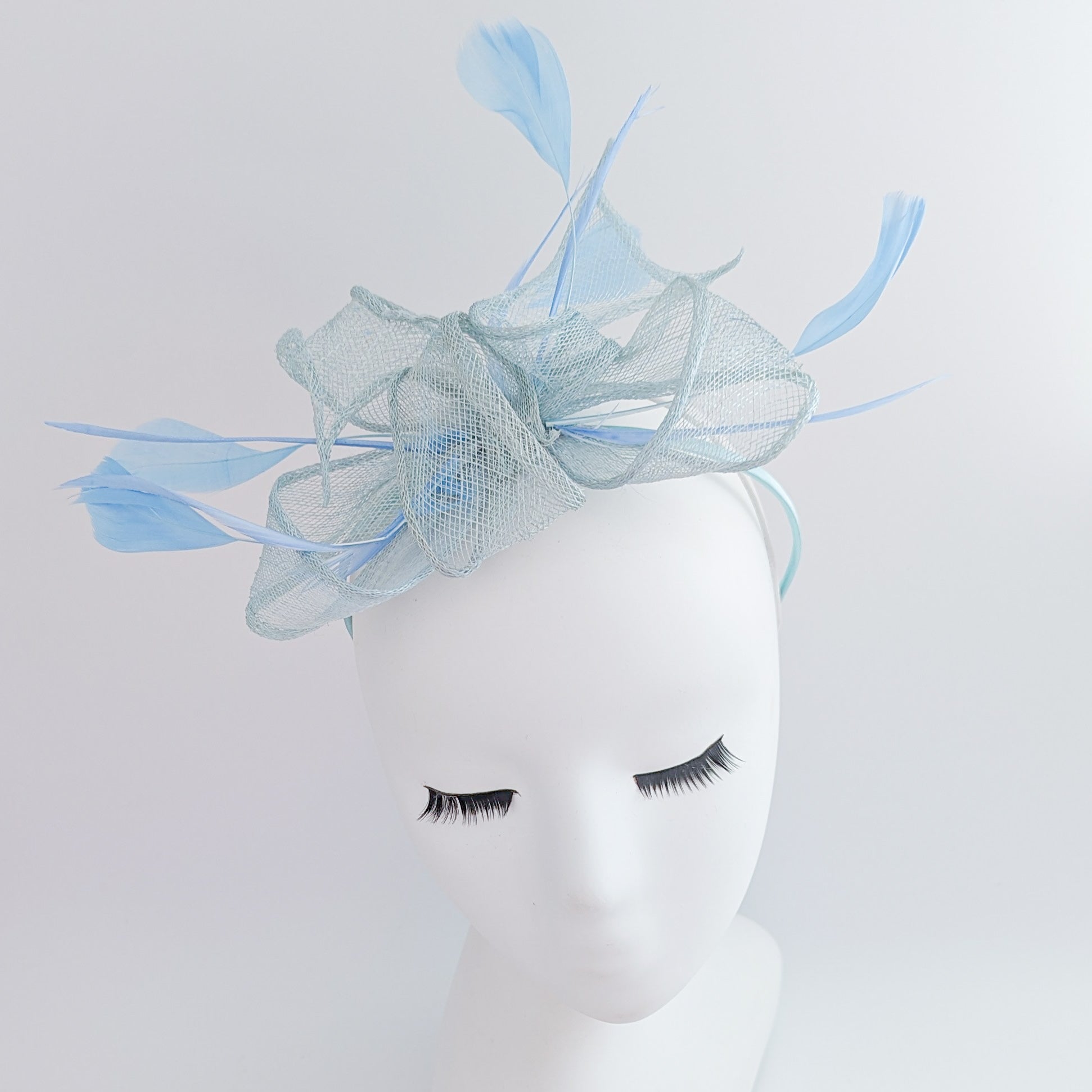 Aquamarine blue feather fascinator hat Aquamarine blue feather fascinator hat