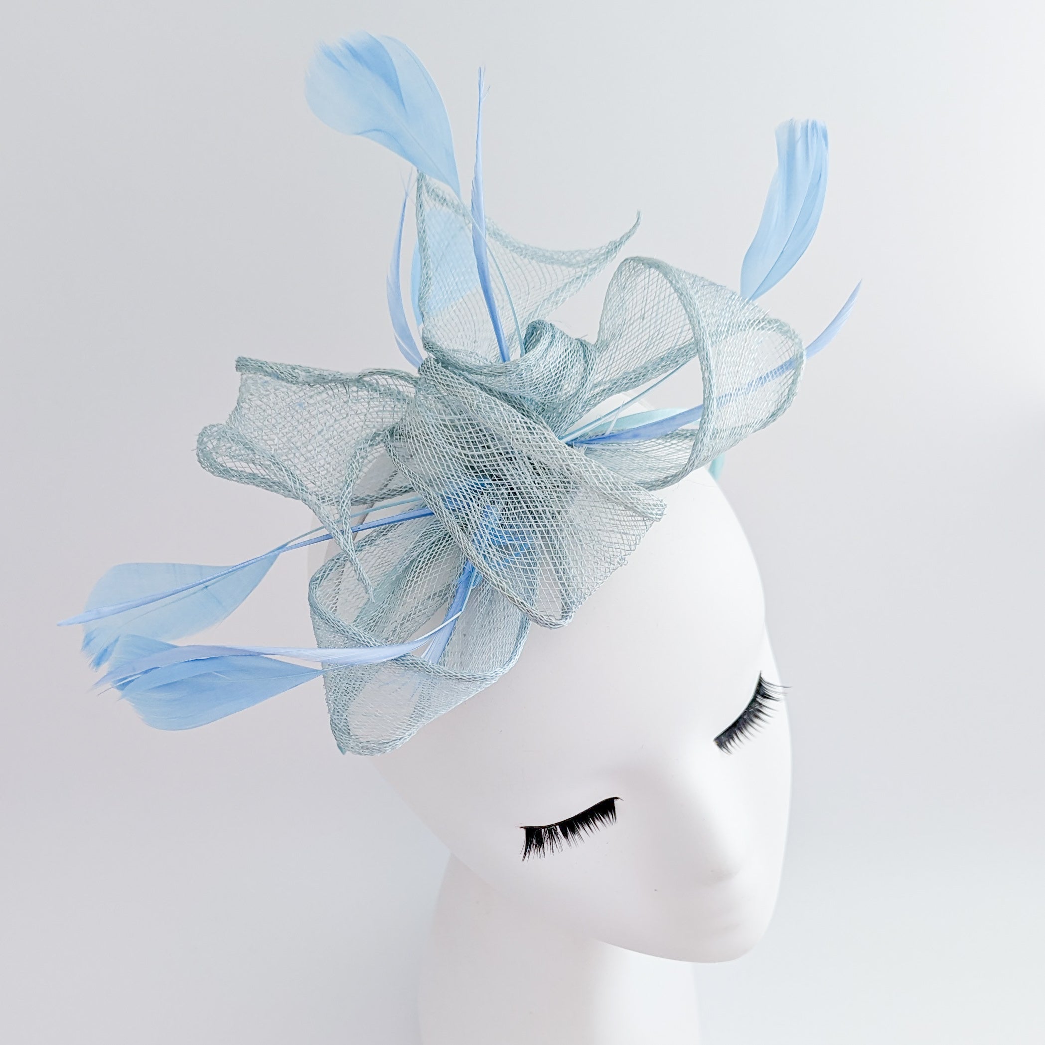 Aquamarine blue feather fascinator hat Aquamarine blue feather fascinator hat