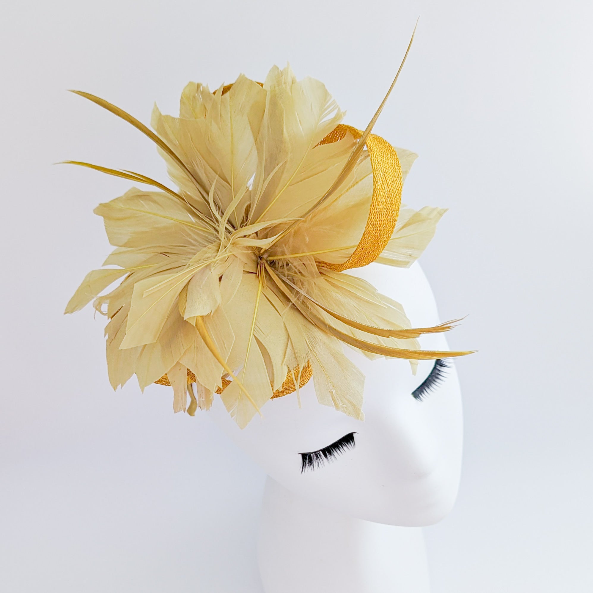 Golden yellow feather fascinator hat