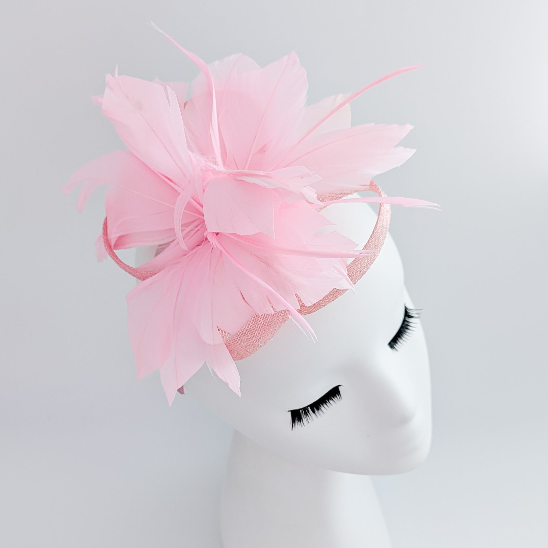 Light candy pink feather fascinator hat