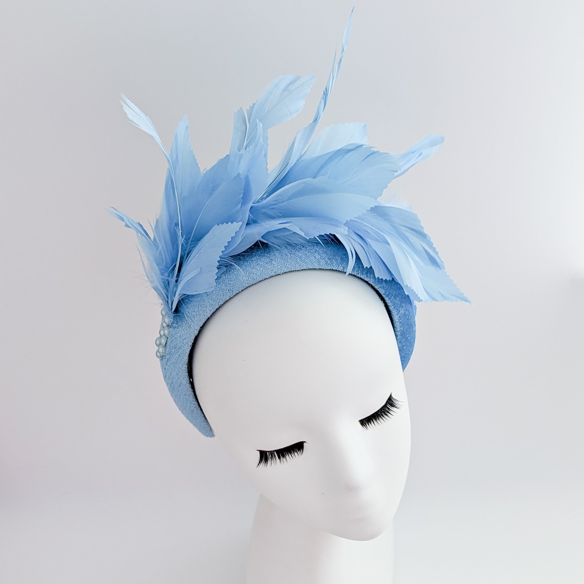 Light cornflower blue feather padded velvet headband fascinator Light cornflower blue feather padded velvet headband fascinator
