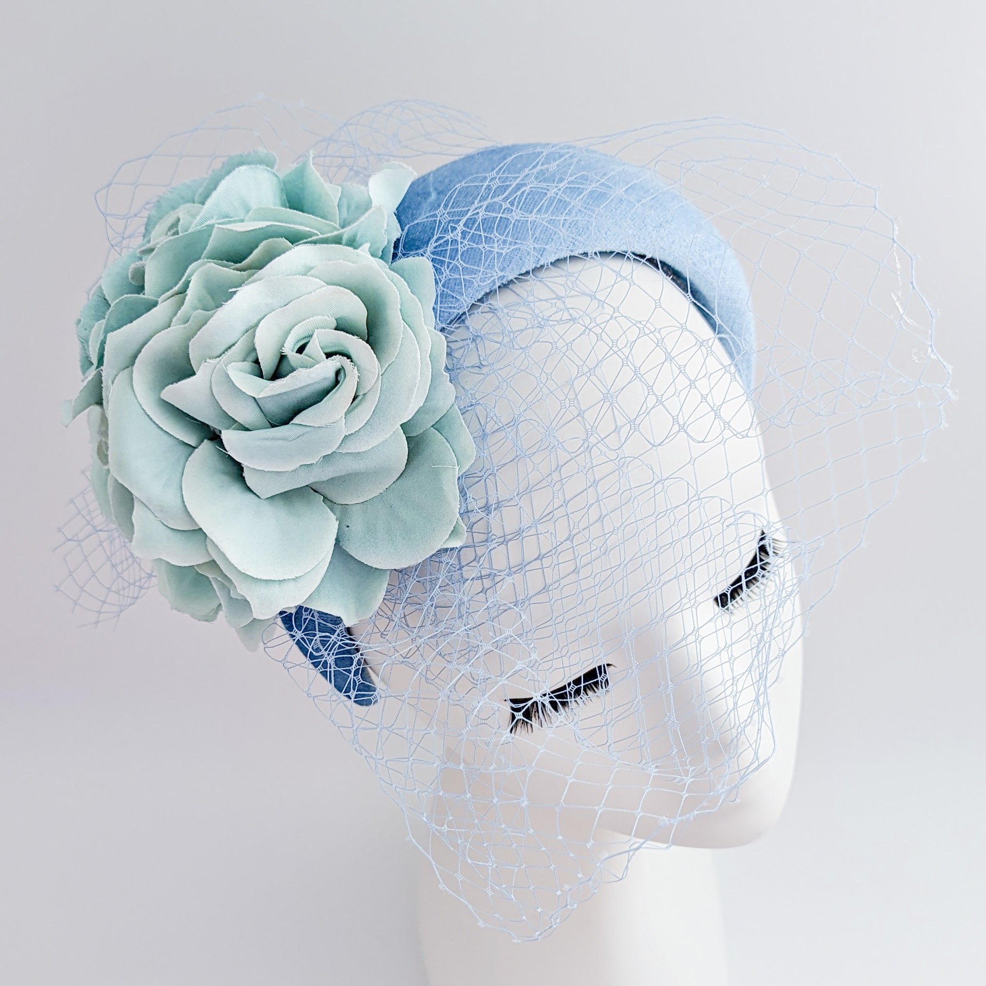 Light cornflower blue aquamarine flower padded velvet headband fascinator