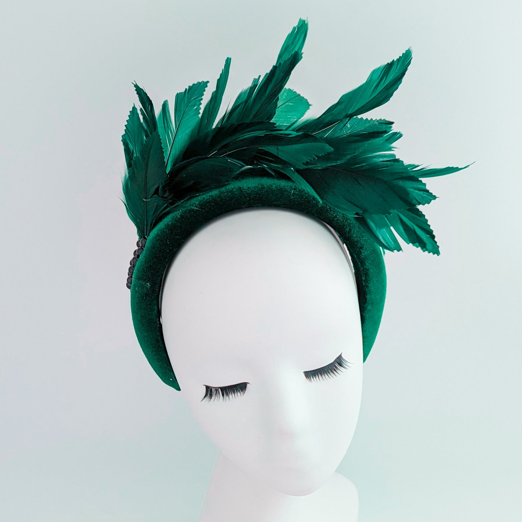 Dark emerald green feather padded velvet headband fascinator Dark emerald green feather padded velvet headband fascinator