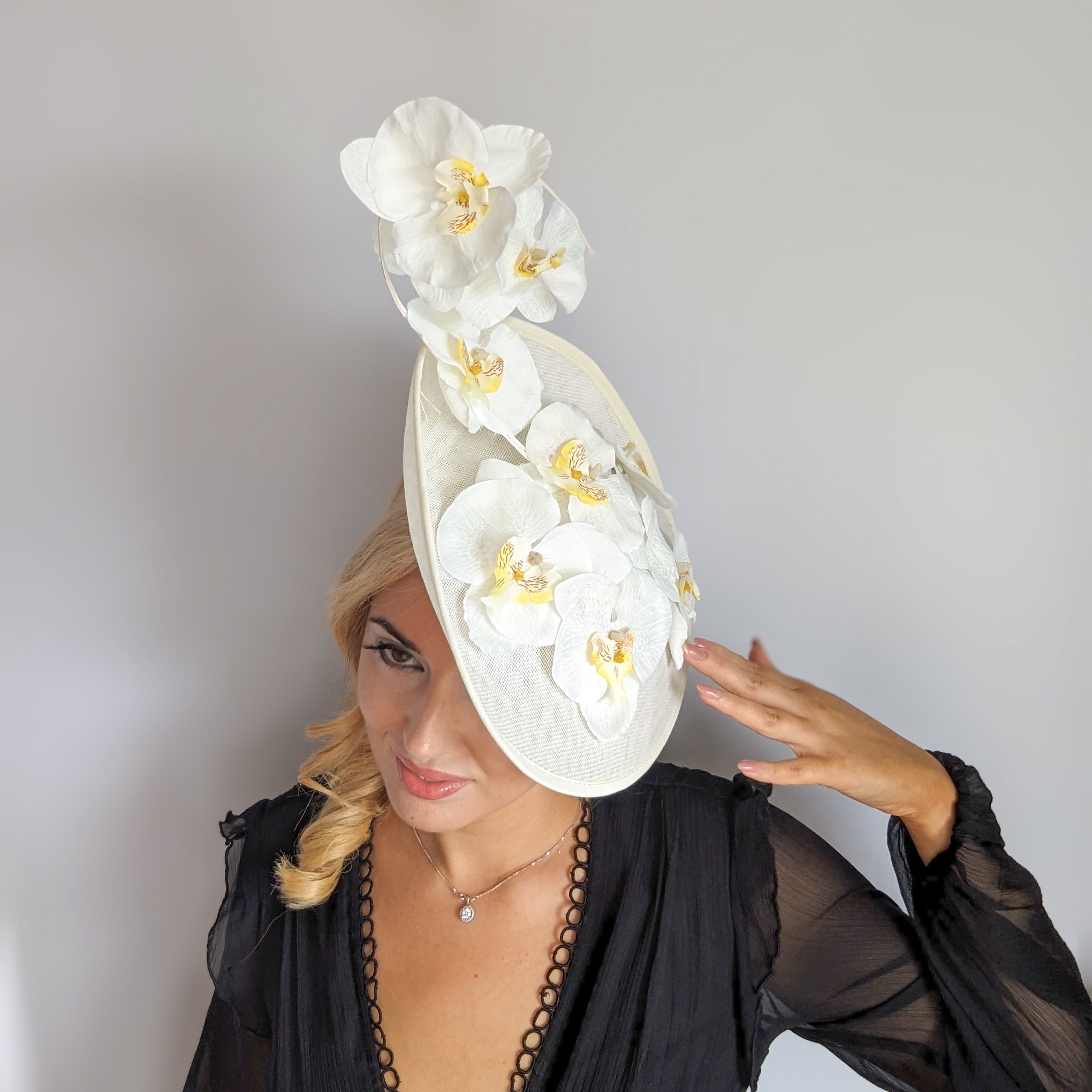 Cream large white orchid flower saucer disc fascinator hat Cream large white orchid flower saucer disc fascinator hat