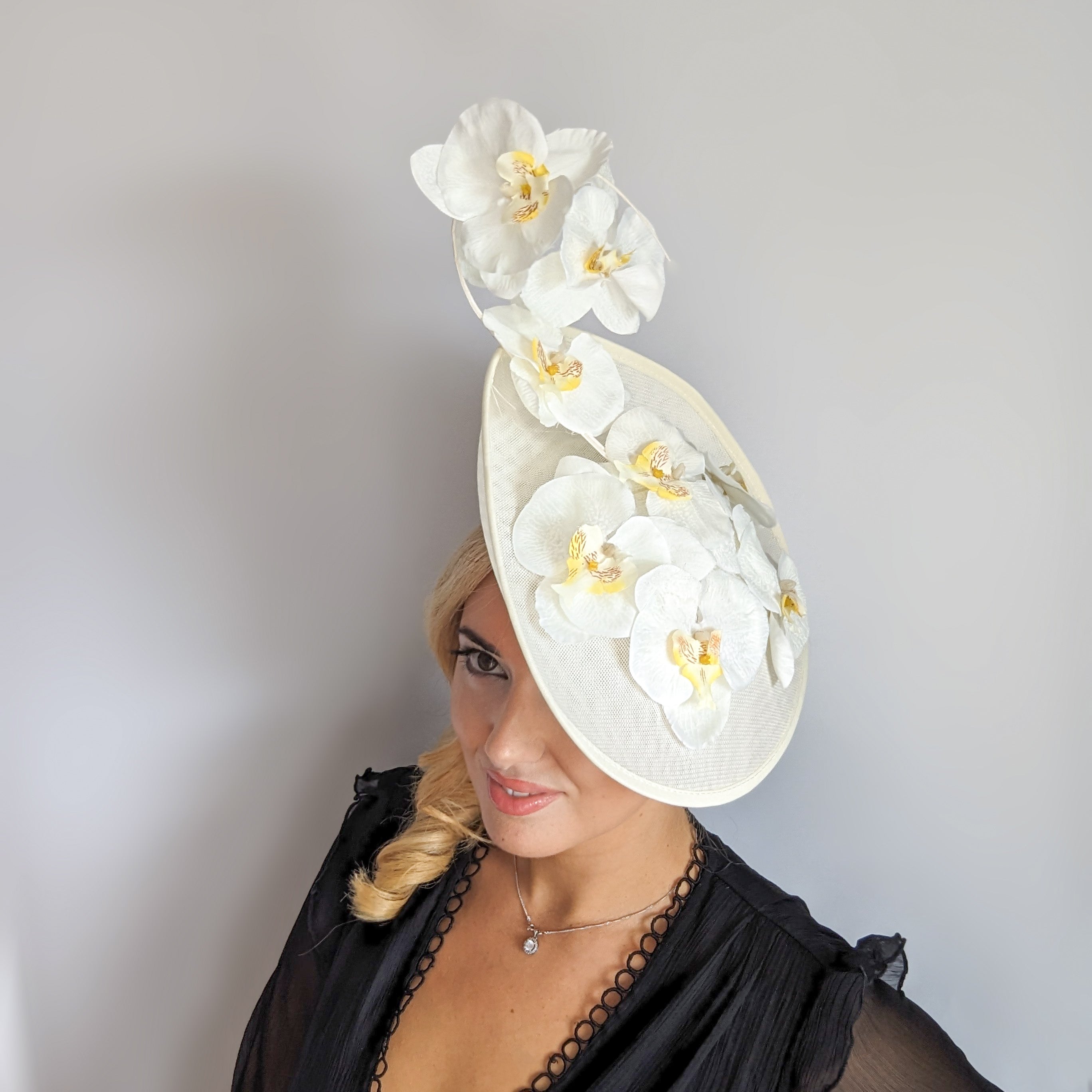 Cream large white orchid flower saucer disc fascinator hat Cream large white orchid flower saucer disc fascinator hat