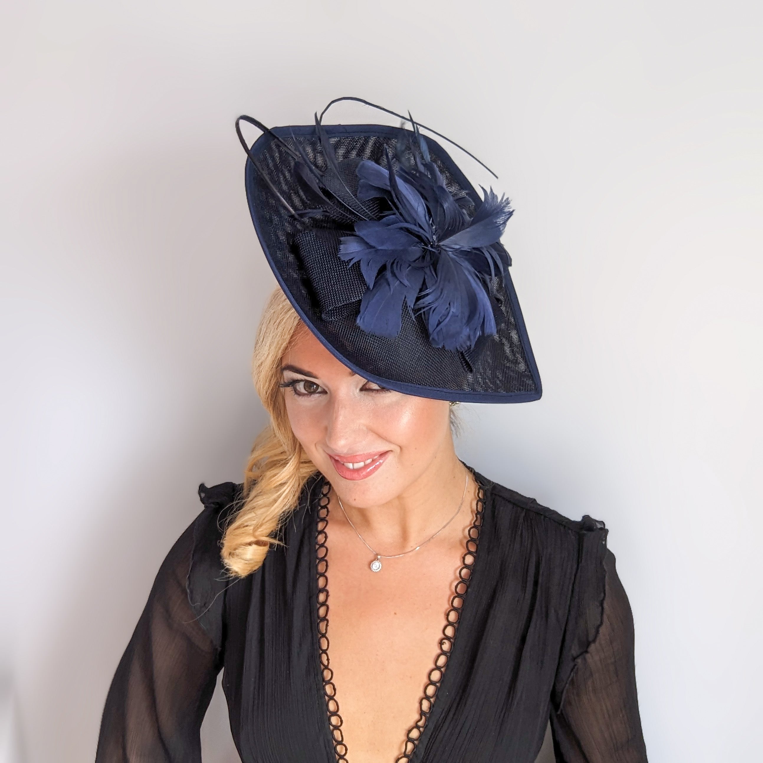 Navy blue large teardrop feather fascinator hat Navy blue large teardrop feather fascinator hat