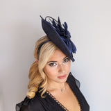 Navy blue large teardrop feather fascinator hat Navy blue large teardrop feather fascinator hat