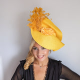 Yellow large woven straw flower feather fascinator hat Yellow large woven straw flower feather fascinator hat