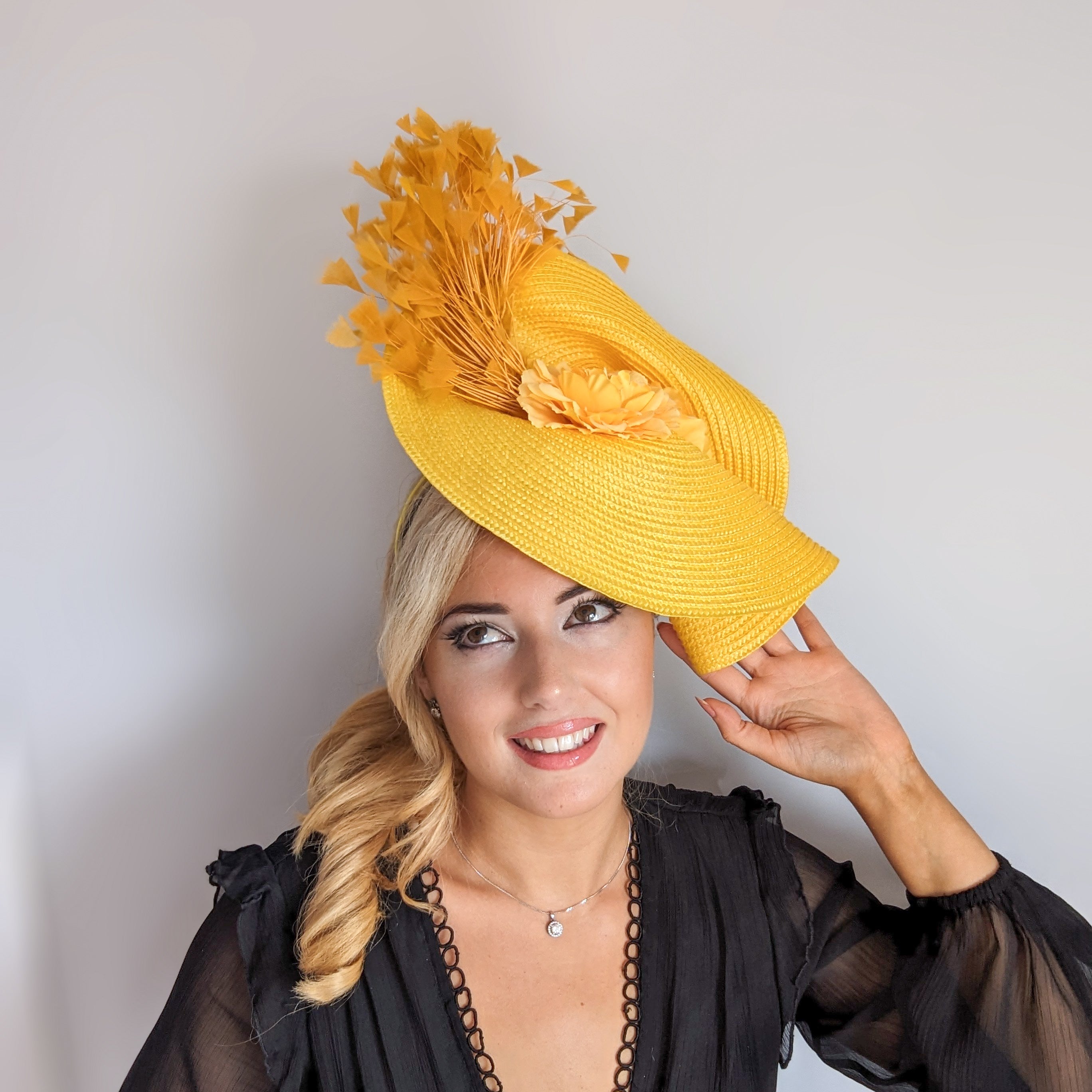 Yellow large woven straw flower feather fascinator hat Yellow large woven straw flower feather fascinator hat