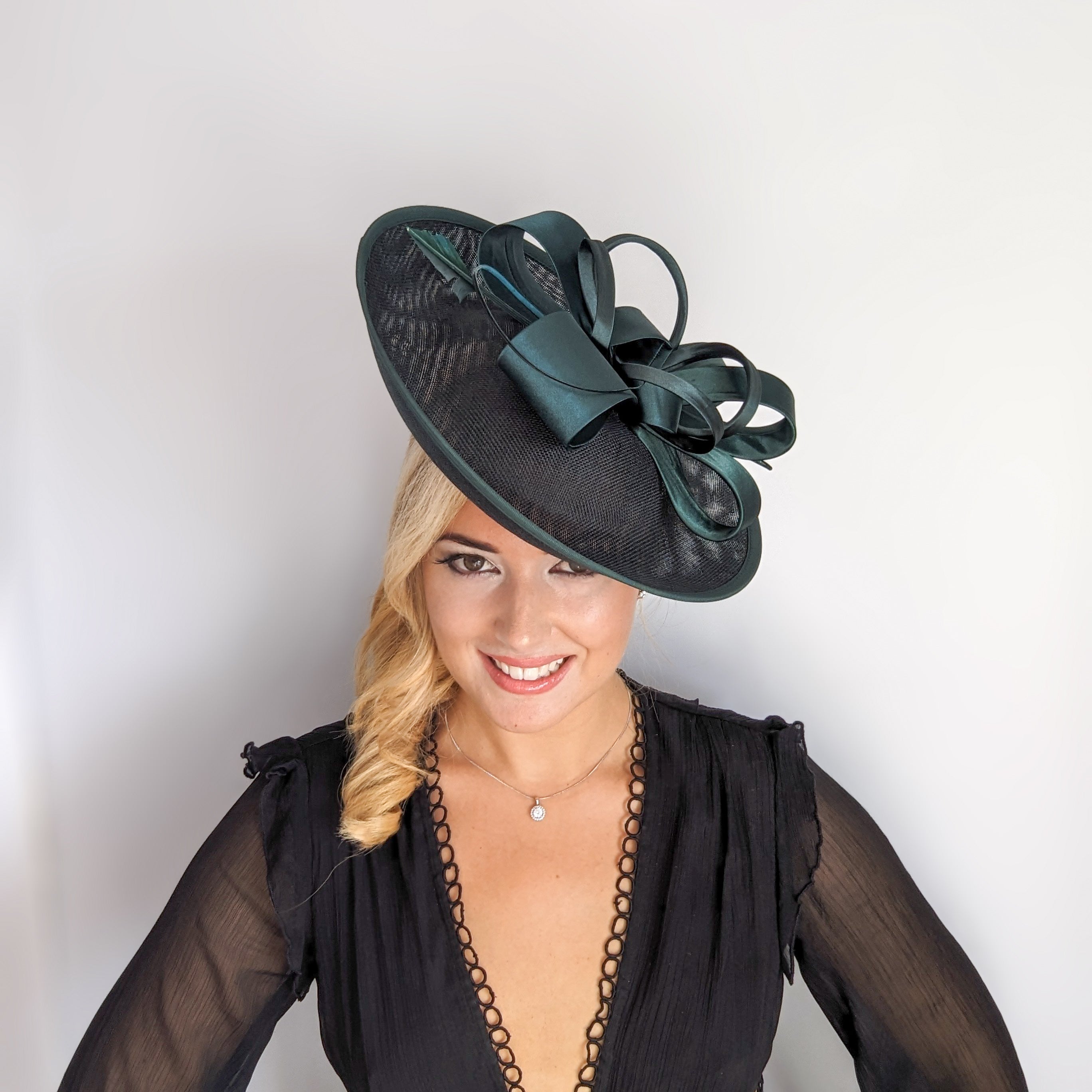 Dark emerald green feather large saucer disc fascinator hat Dark emerald green feather large saucer disc fascinator hat