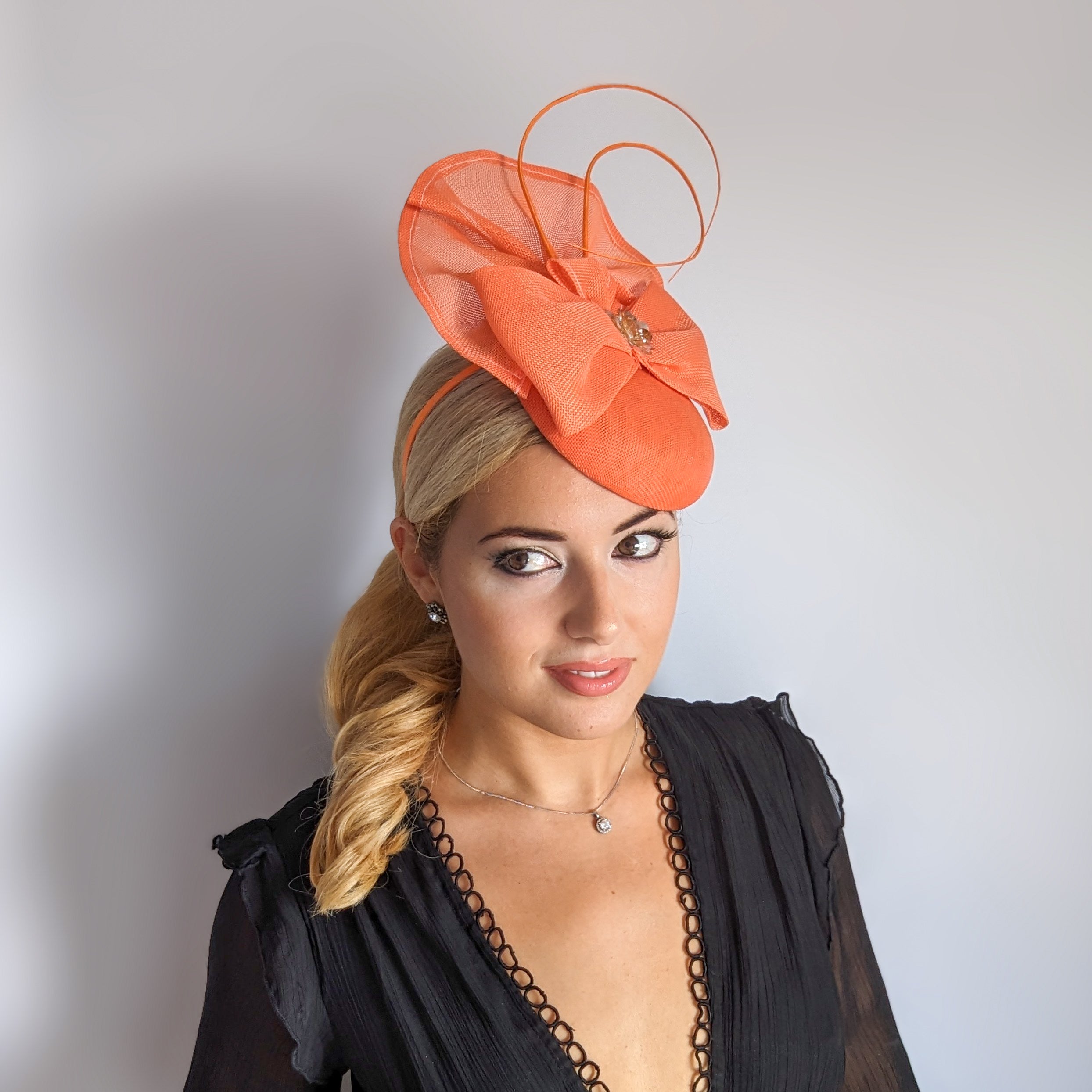 Coral orange crystal bow fascinator hat Coral orange crystal bow fascinator hat