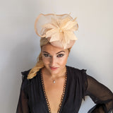 Light peach pink pearl feather fascinator hat Light peach pink pearl feather fascinator hat