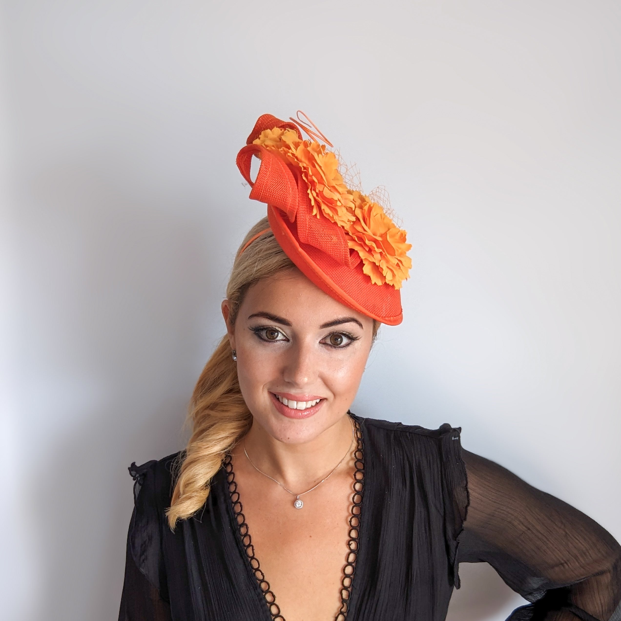 Orange flower fascinator disc saucer hat Orange flower fascinator disc saucer hat