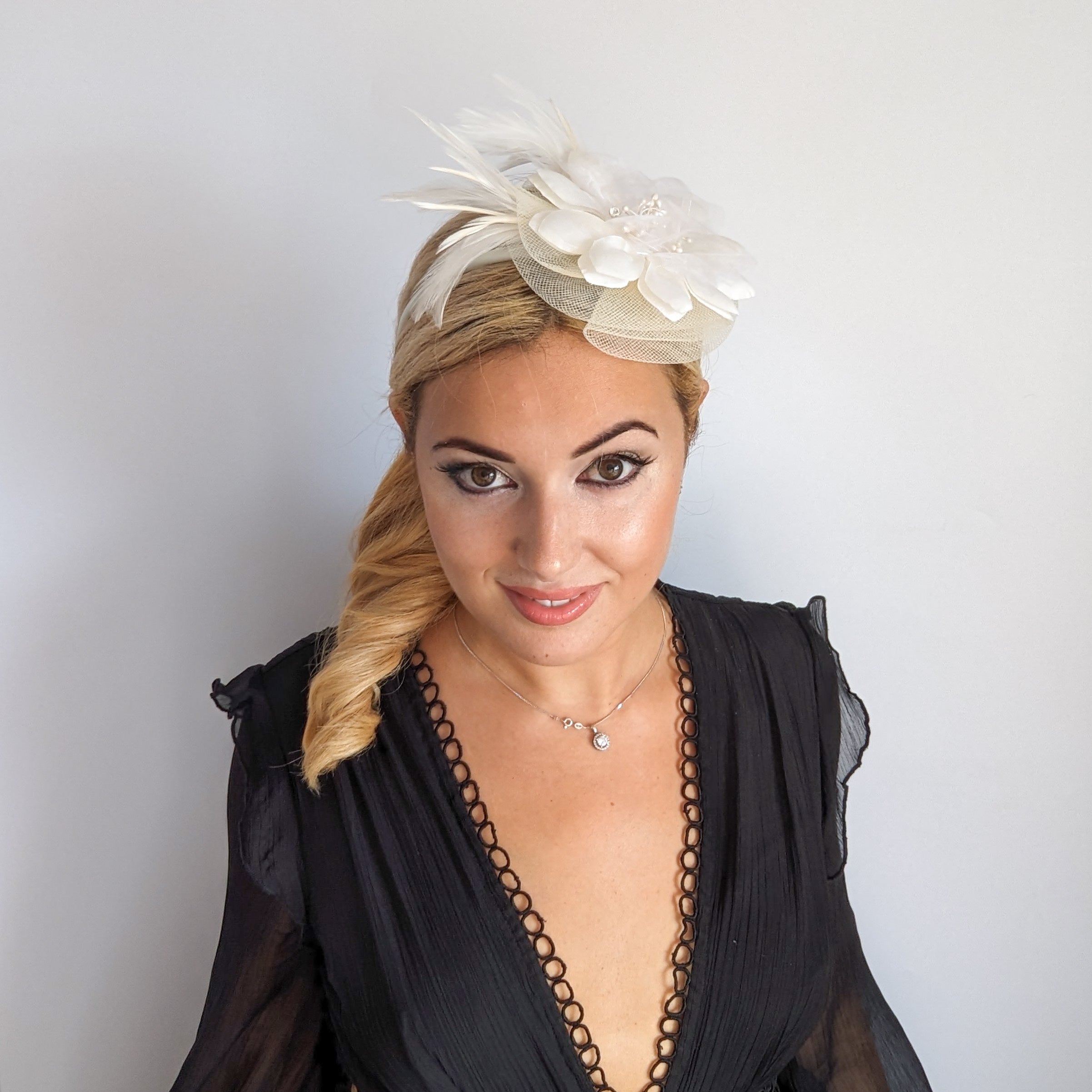 Cream feather flower fascinator hat Cream feather flower fascinator hat