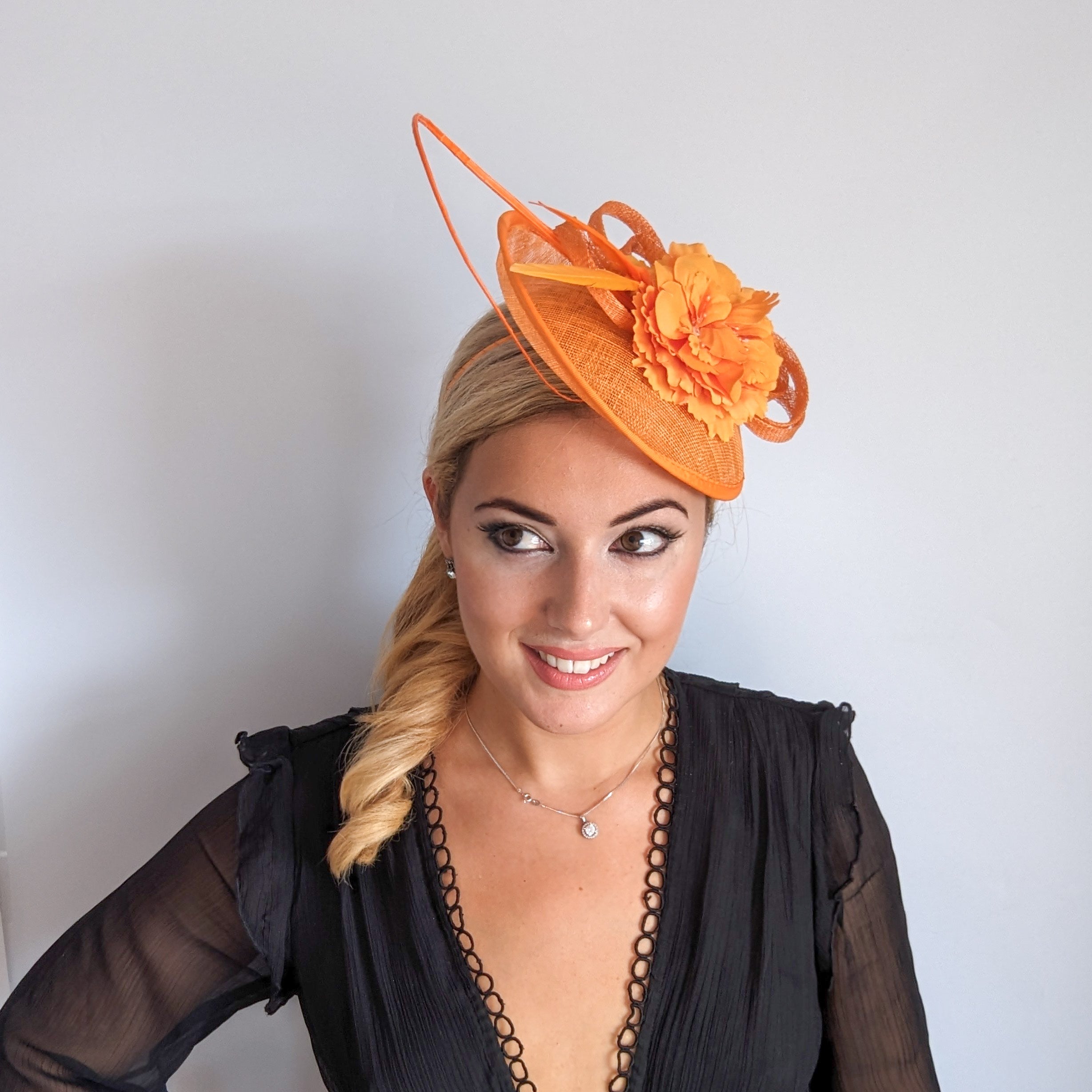 Orange flower fascinator disc saucer hat Orange flower fascinator disc saucer hat