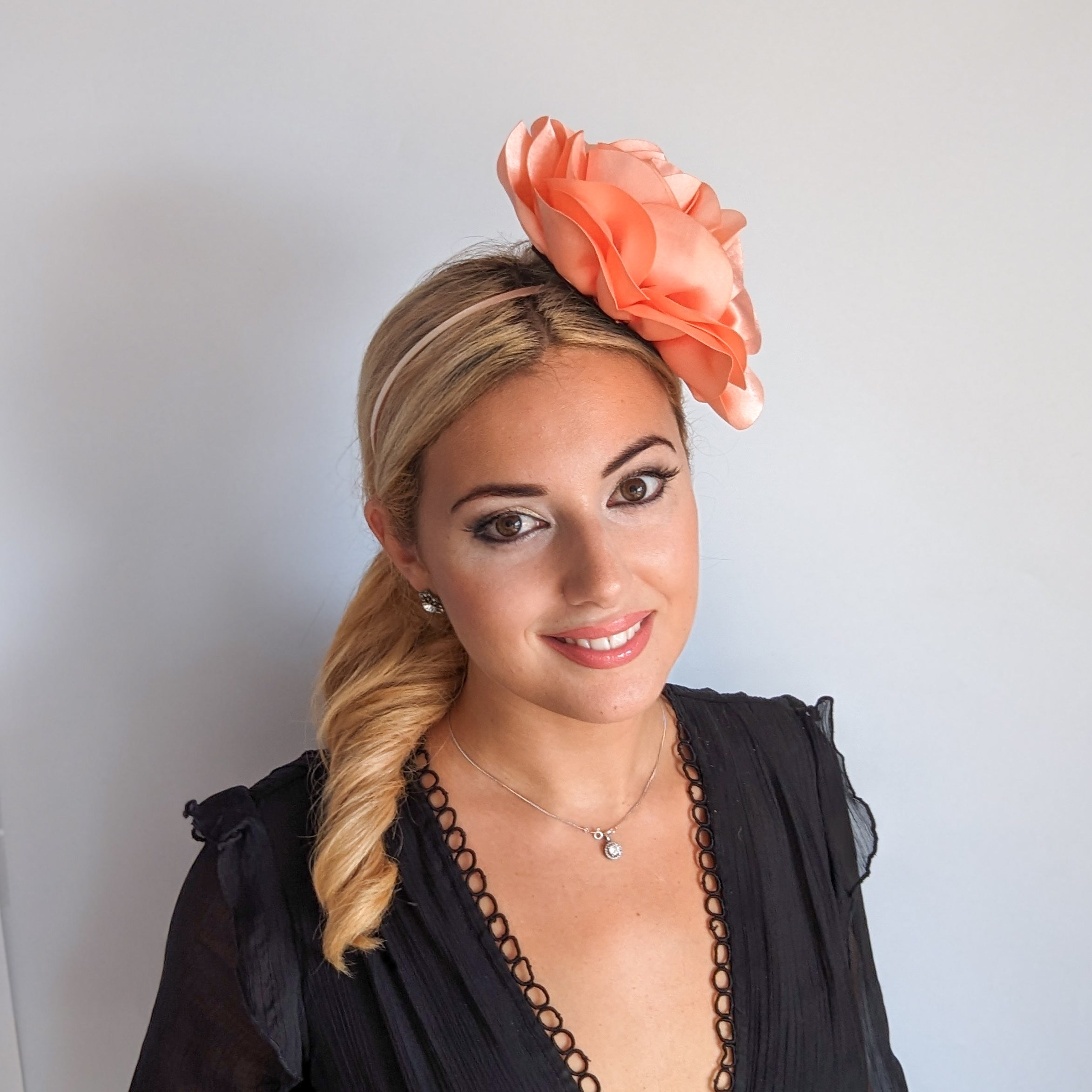 Large peach satin rose fascinator hat Large peach satin rose fascinator hat