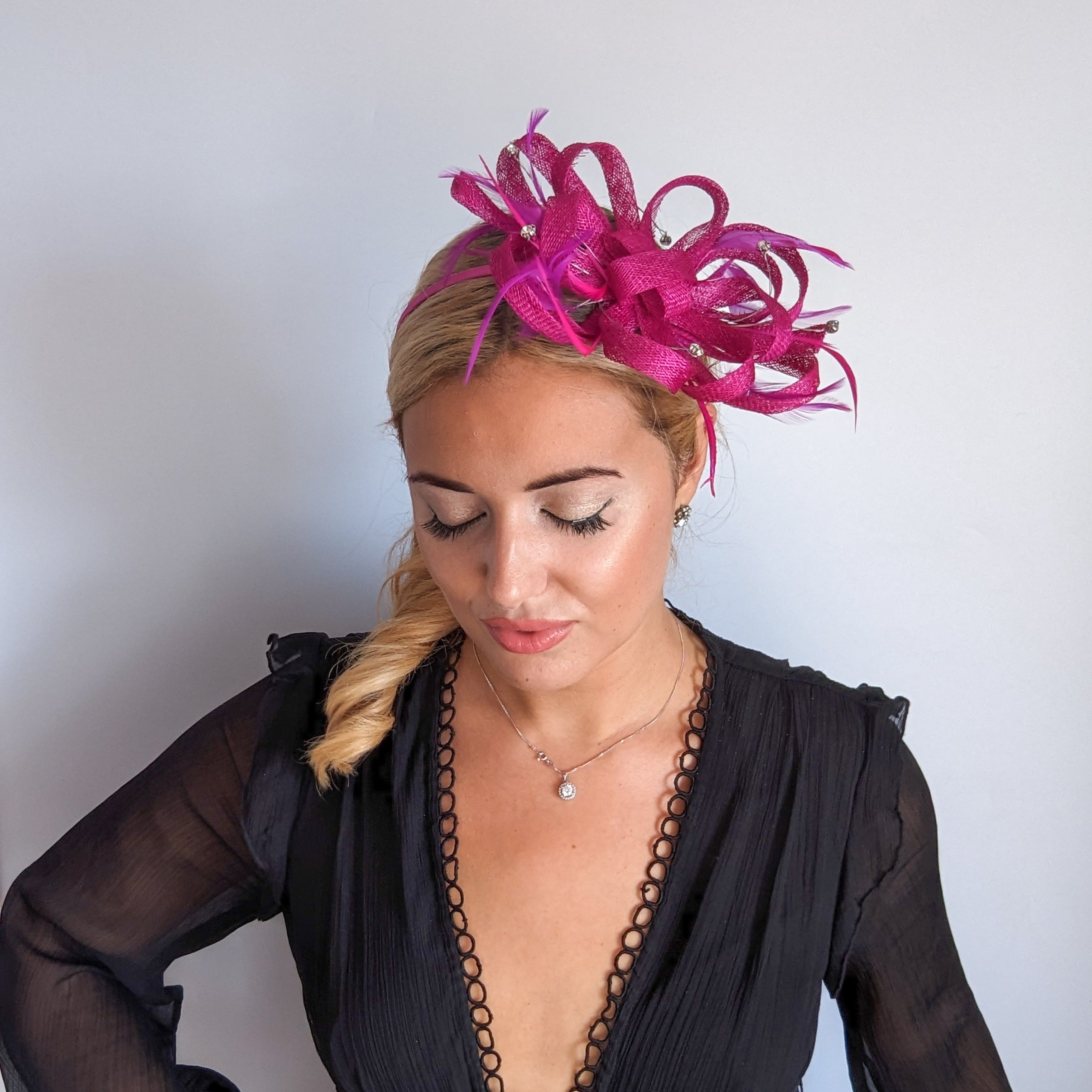 Magenta pink crystal feather fascinator hat Magenta pink crystal feather fascinator hat