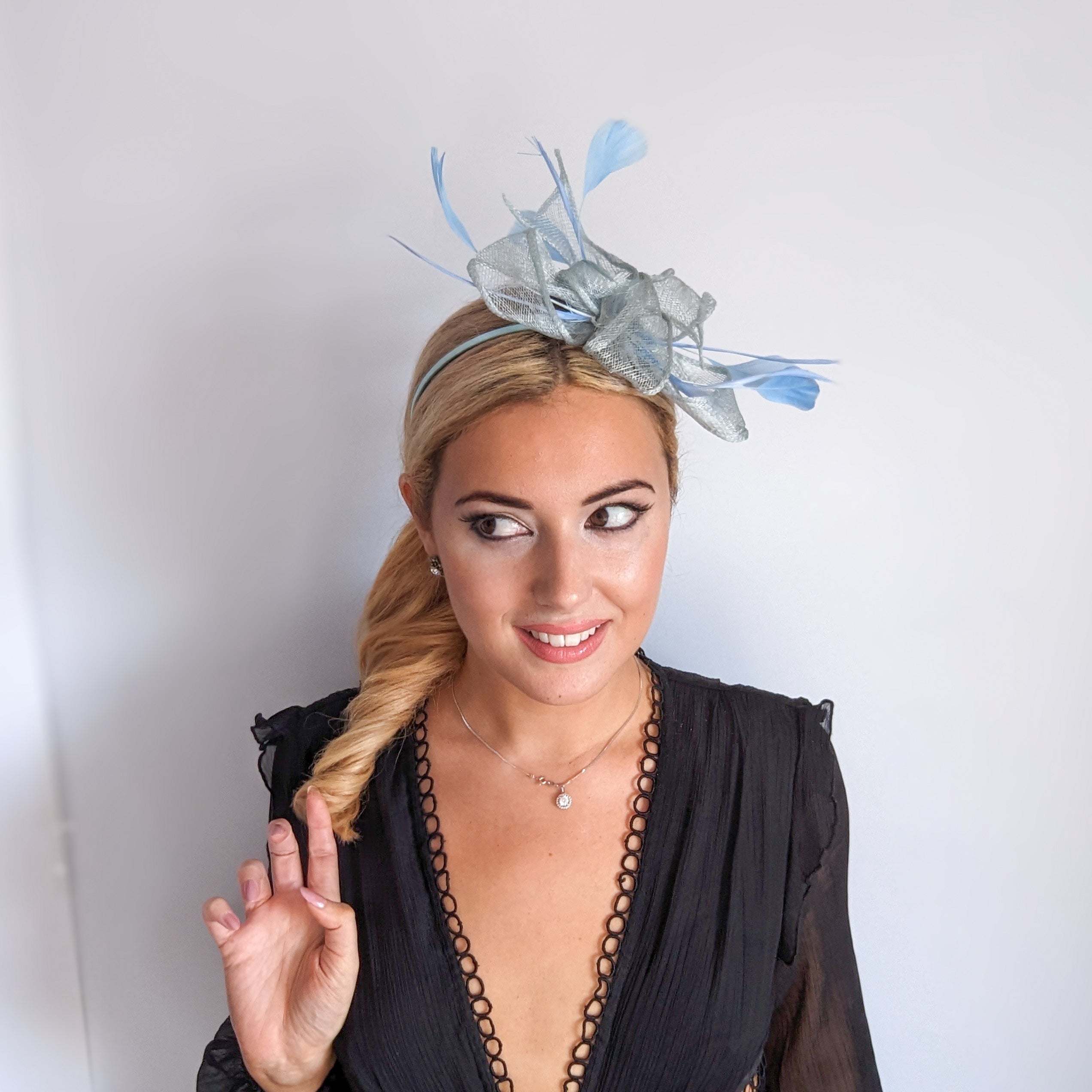 Aquamarine blue feather fascinator hat Aquamarine blue feather fascinator hat
