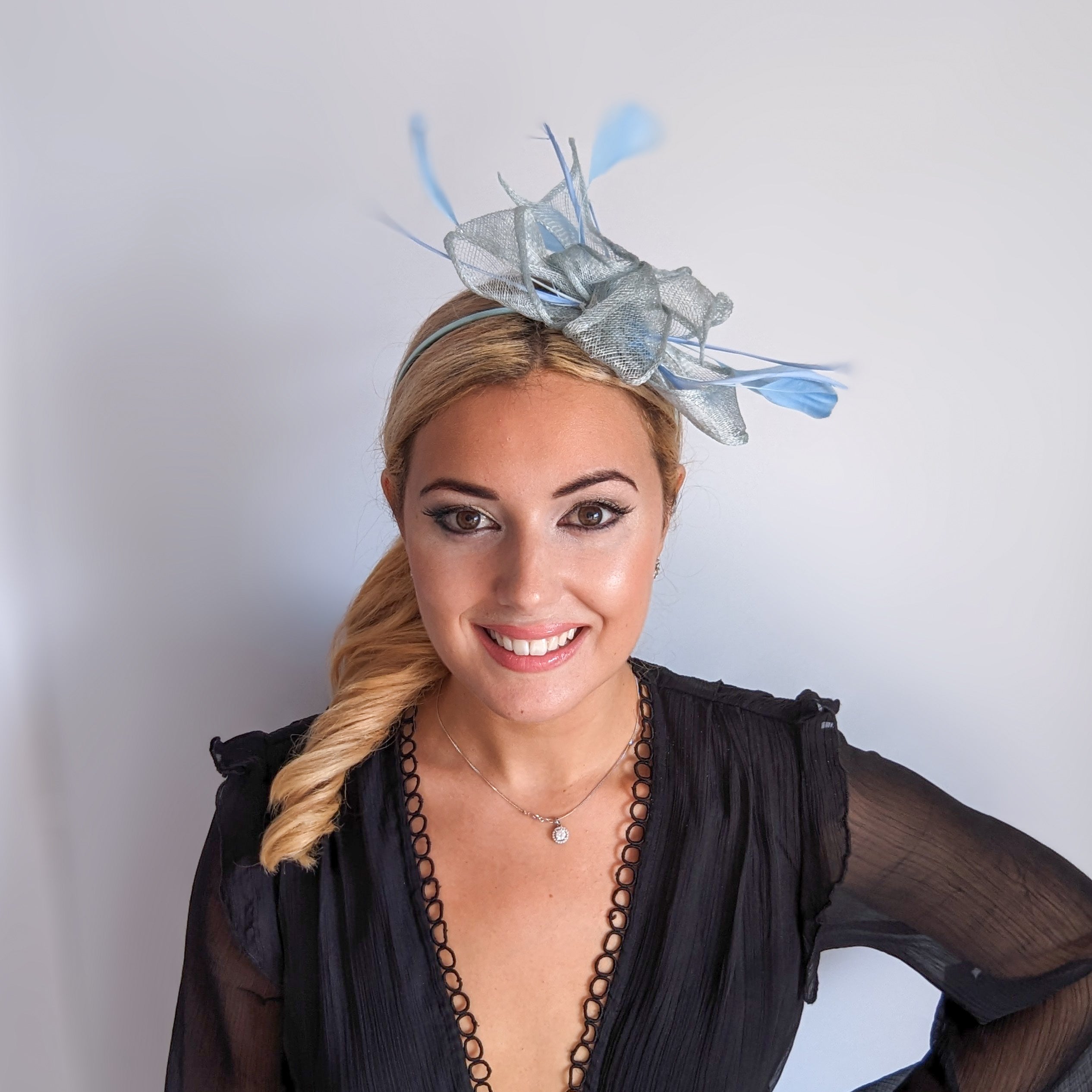 Aquamarine blue feather fascinator hat Aquamarine blue feather fascinator hat