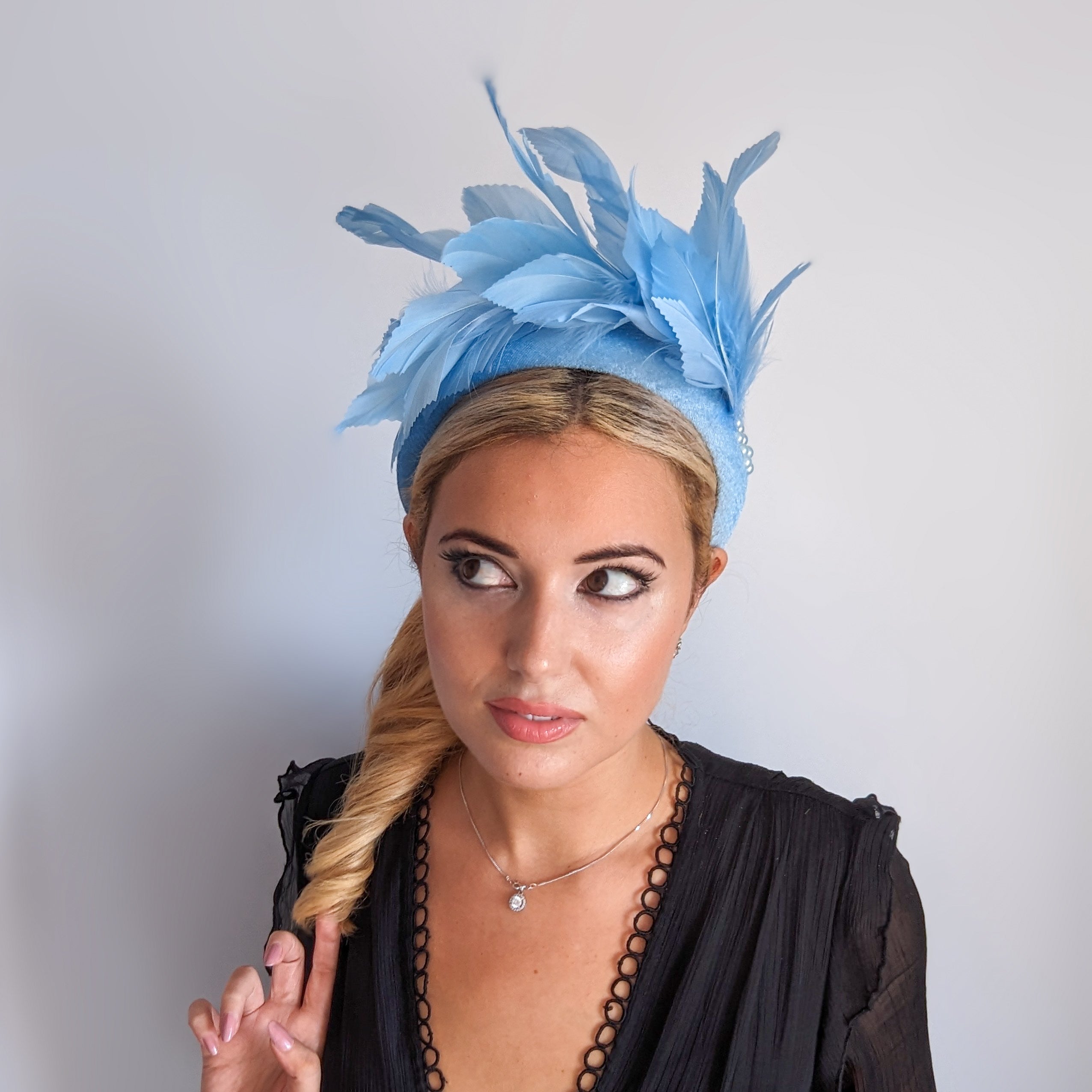 Light cornflower blue feather padded velvet headband fascinator Light cornflower blue feather padded velvet headband fascinator