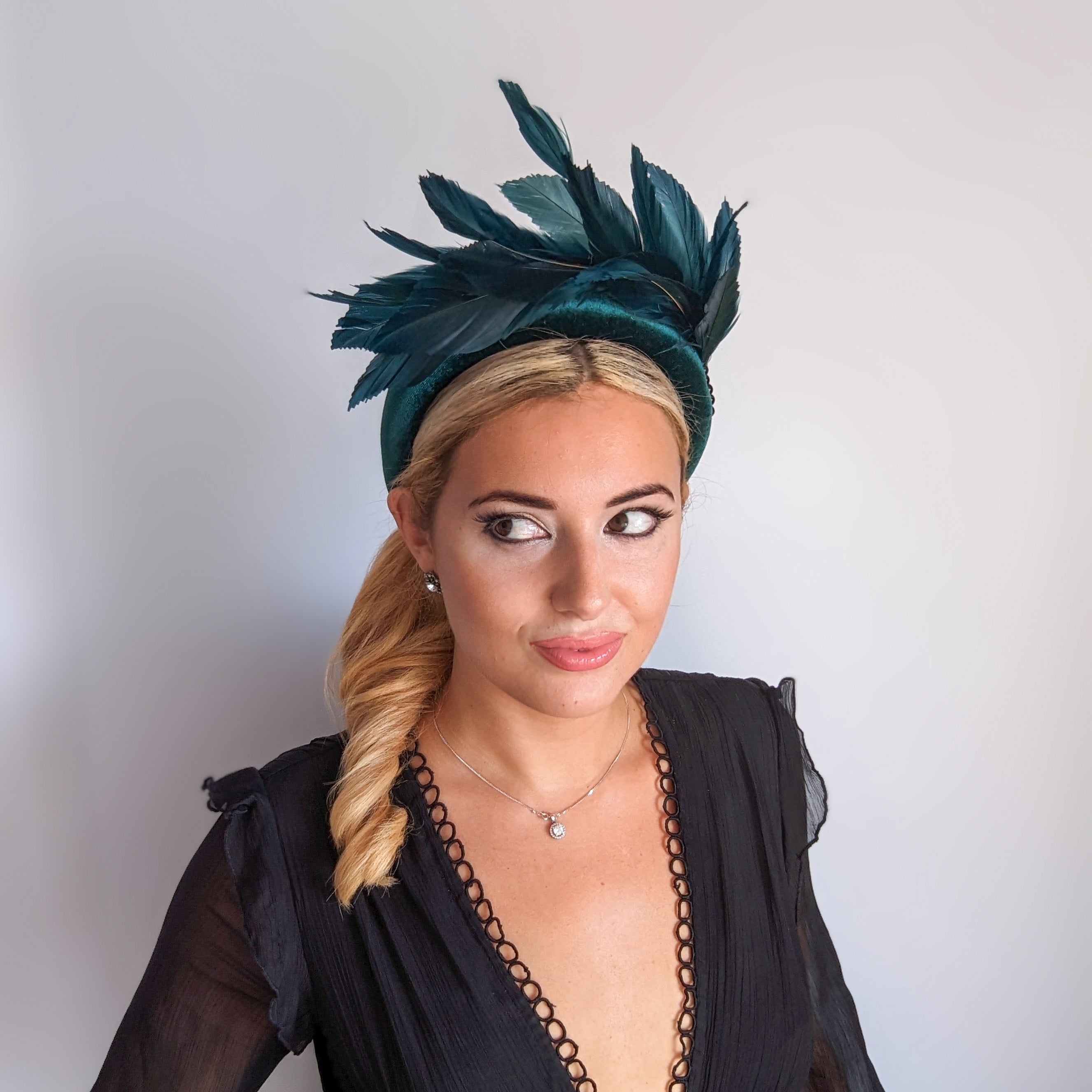 Dark emerald green feather padded velvet headband fascinator Dark emerald green feather padded velvet headband fascinator