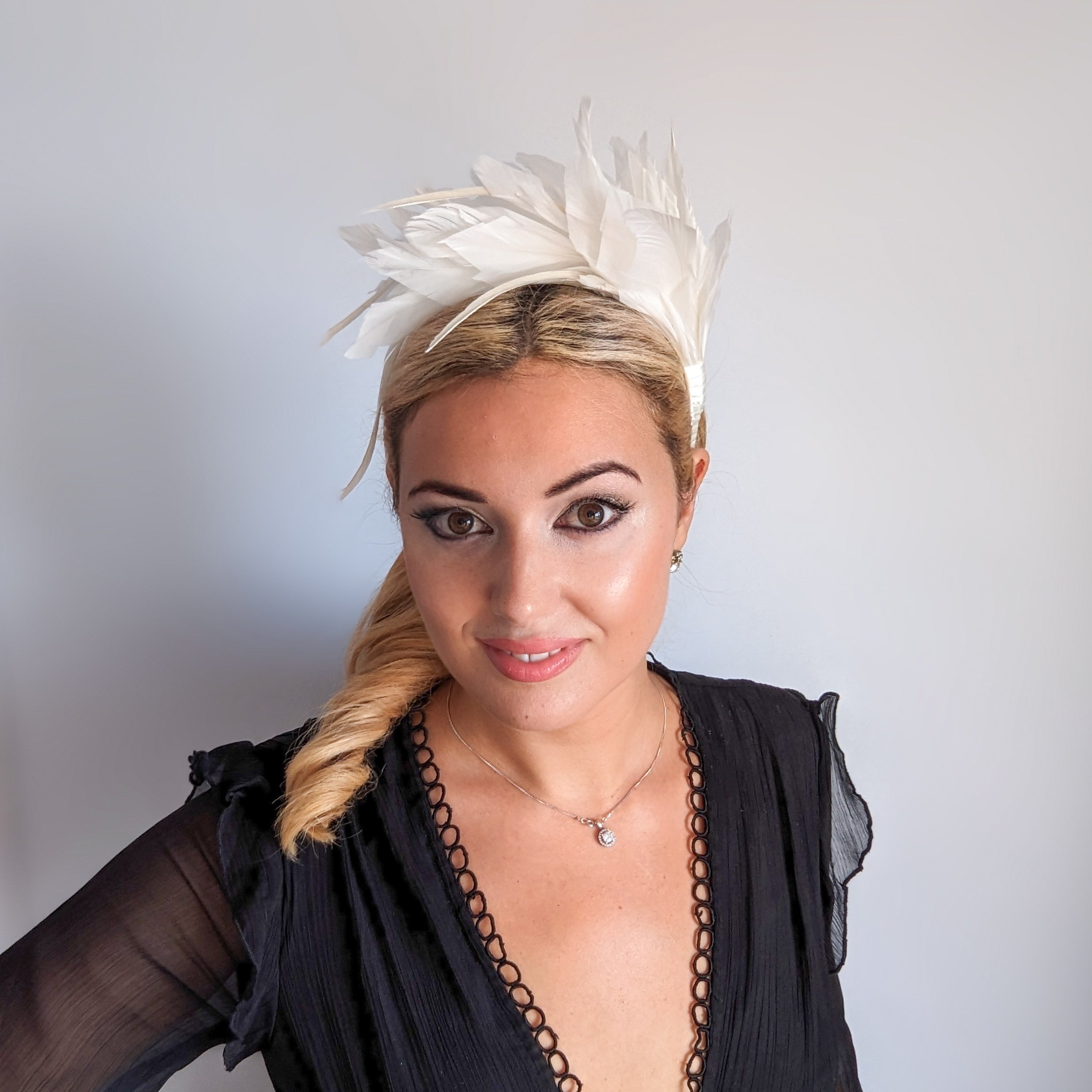 Off White feather satin headband fascinator Off White feather satin headband fascinator