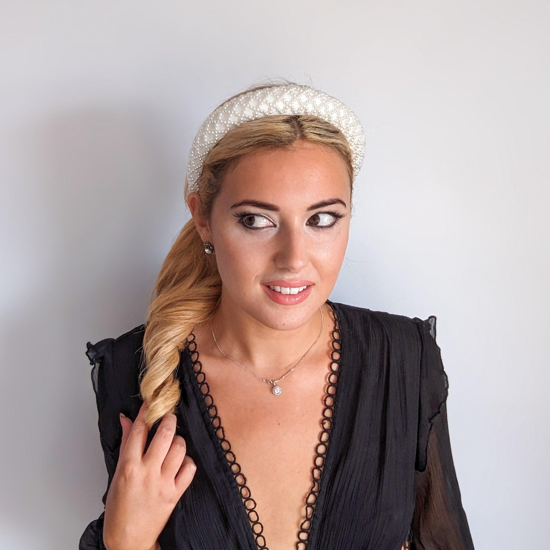 White beaded pearl padded headband fascinator White beaded pearl padded headband fascinator