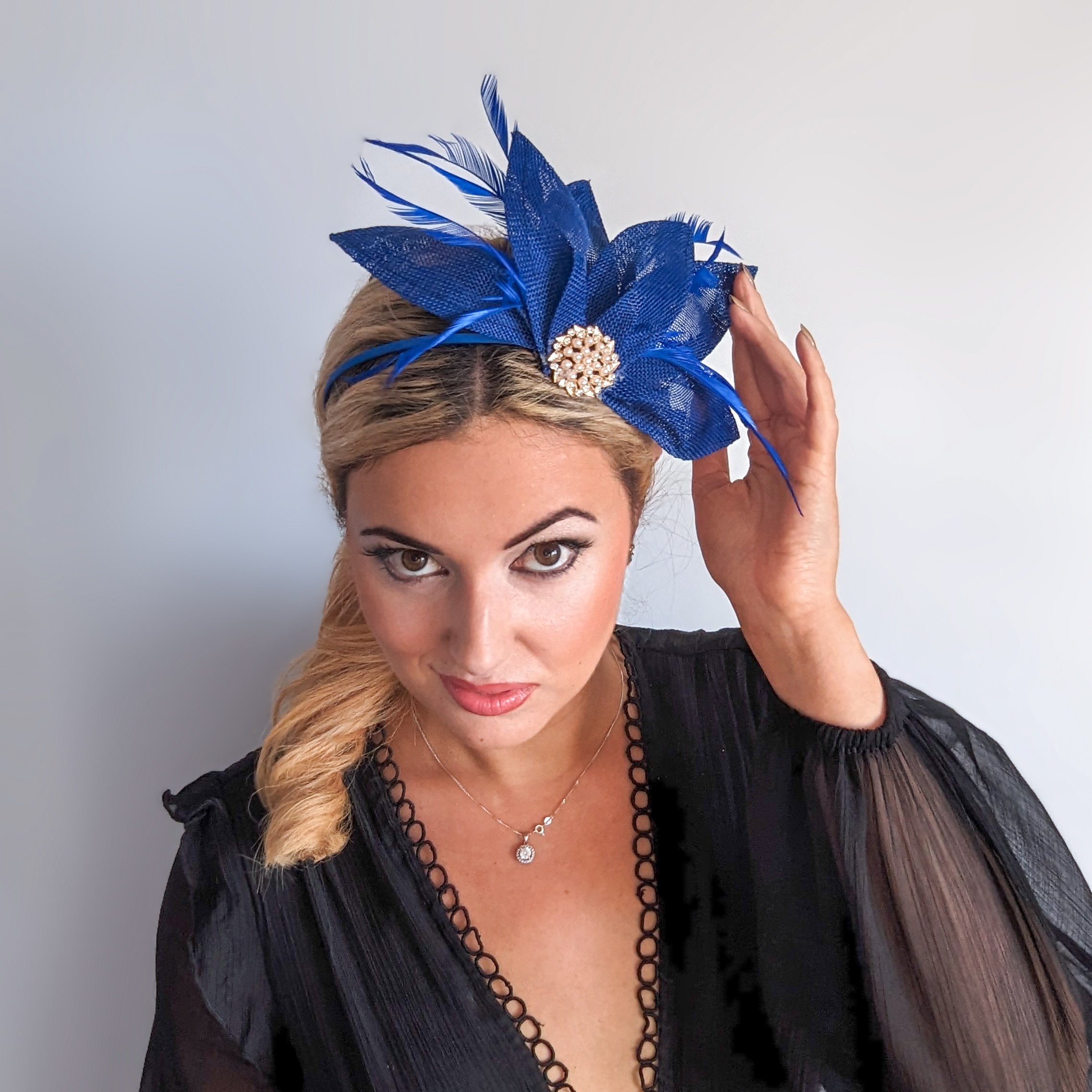 Royal cobalt blue feather petal fan fascinator hat Royal cobalt blue feather petal fan fascinator hat