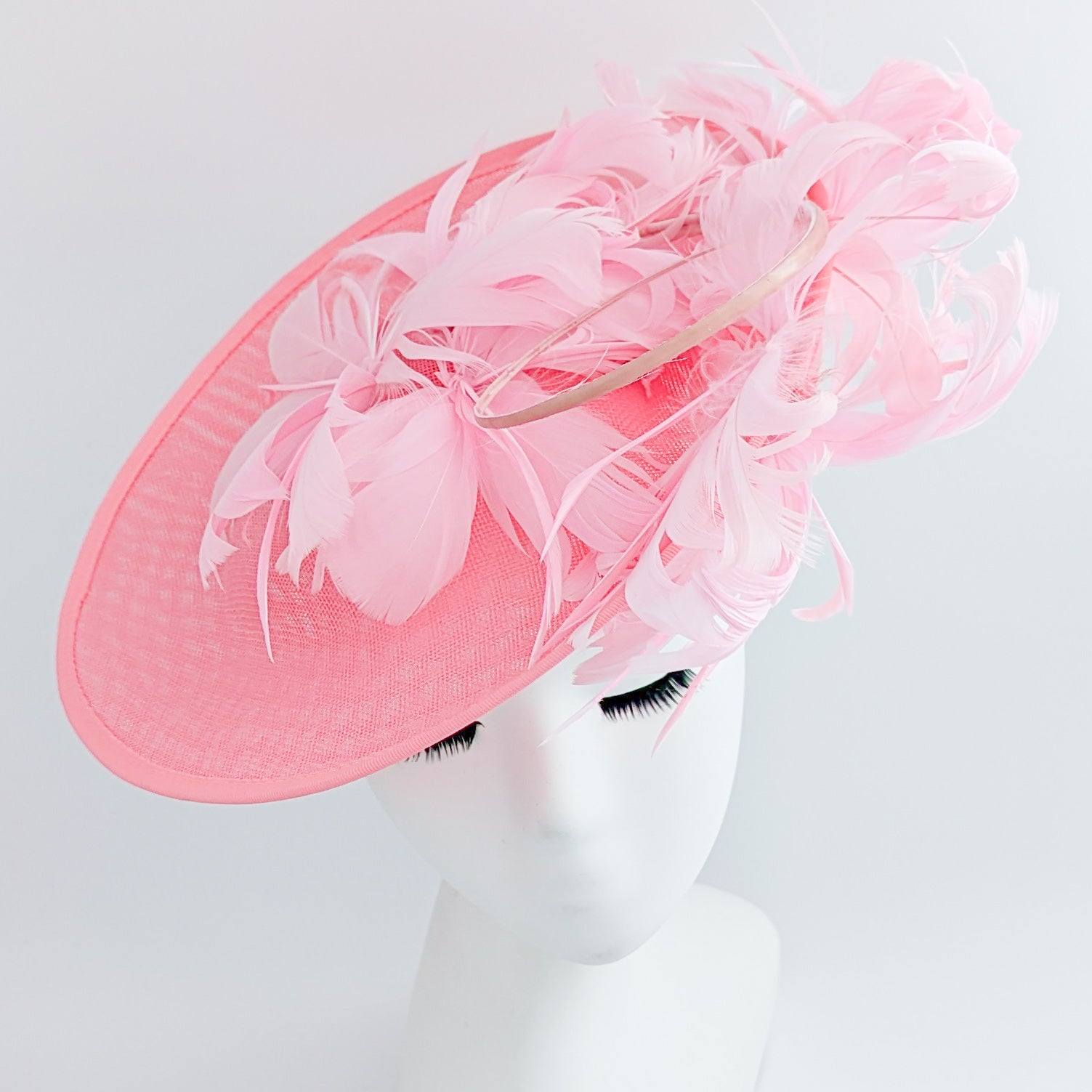 Pink large feather saucer disc fascinator hat