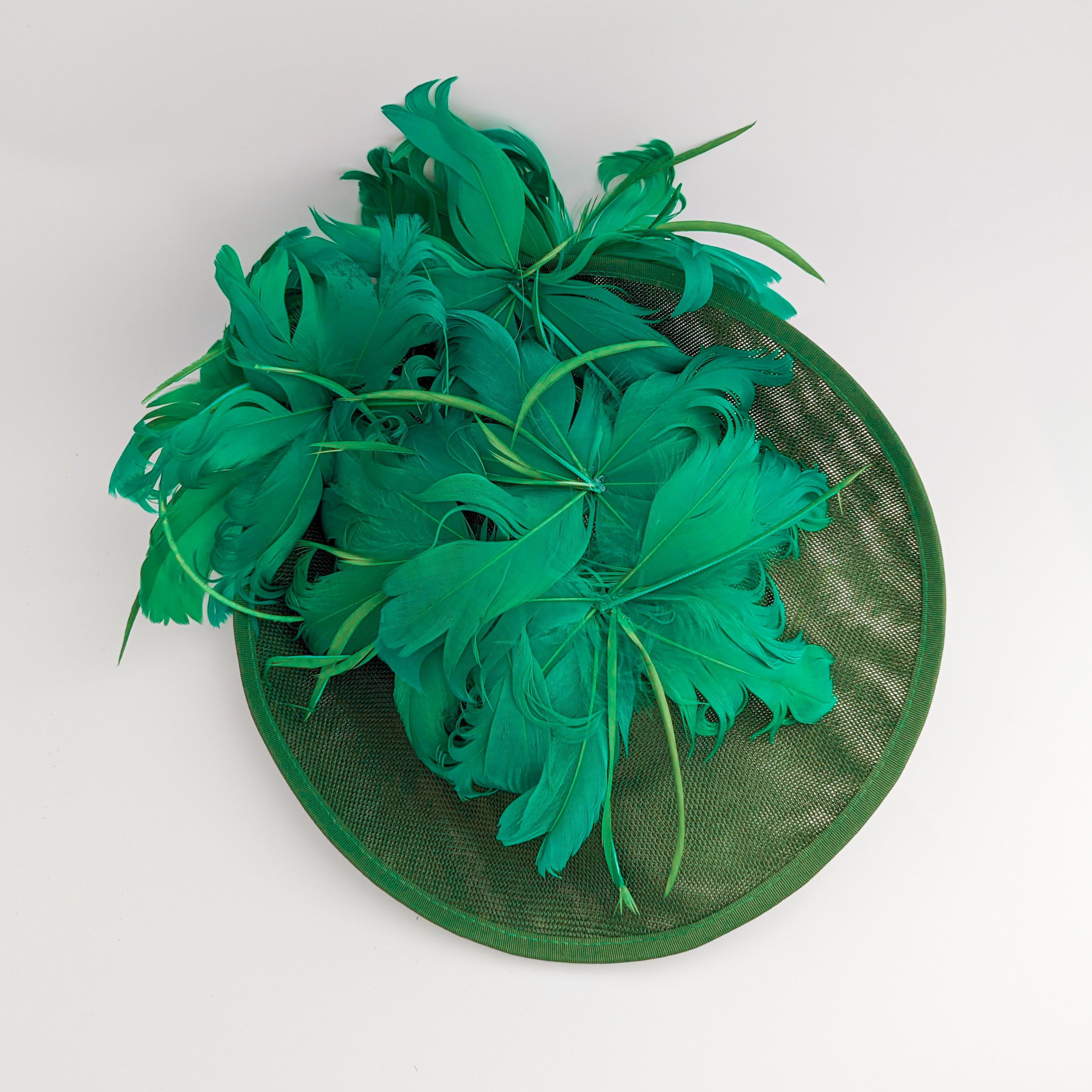 Emerald green feather large saucer disc fascinator hat Emerald green feather large saucer disc fascinator hat