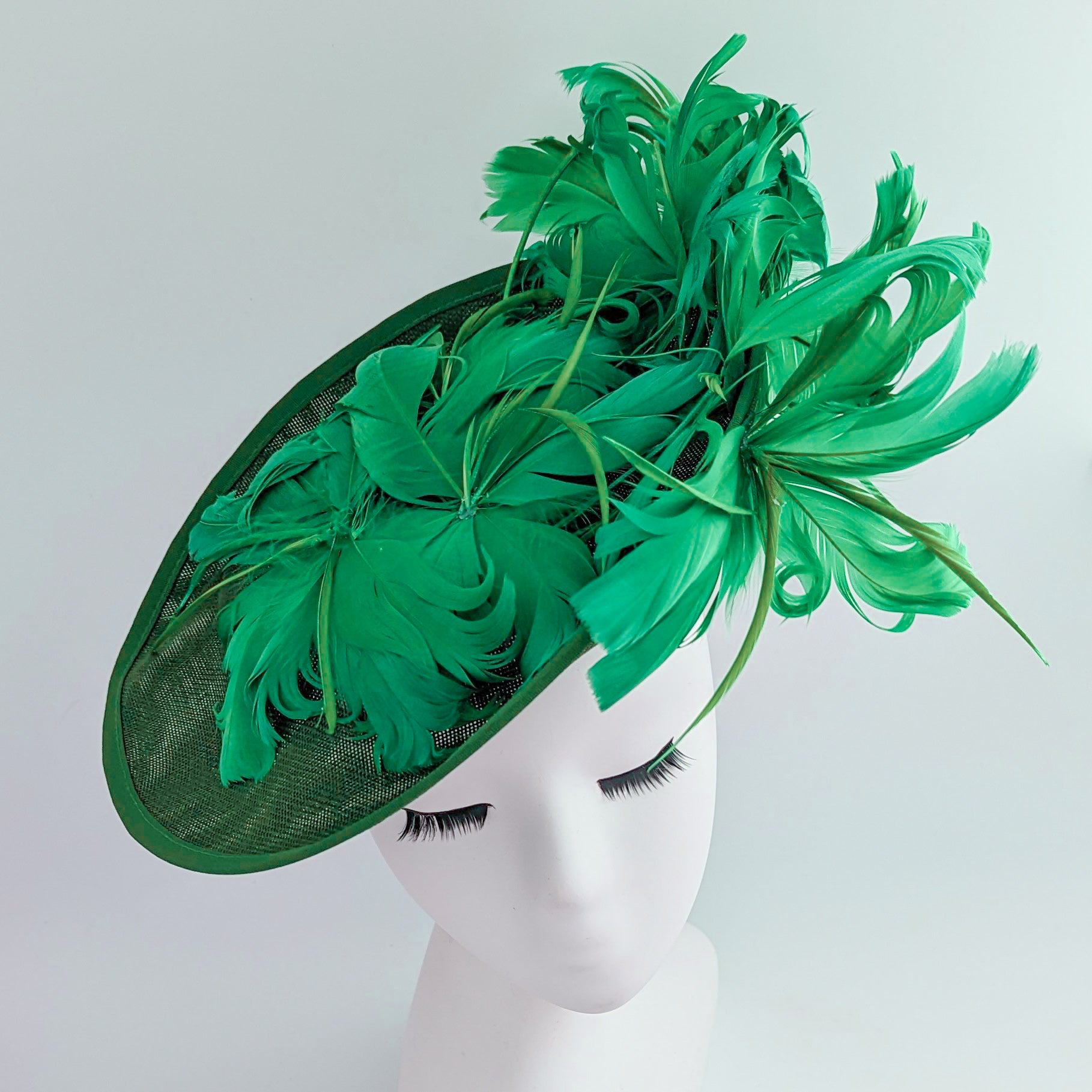 Emerald green feather large saucer disc fascinator hat
