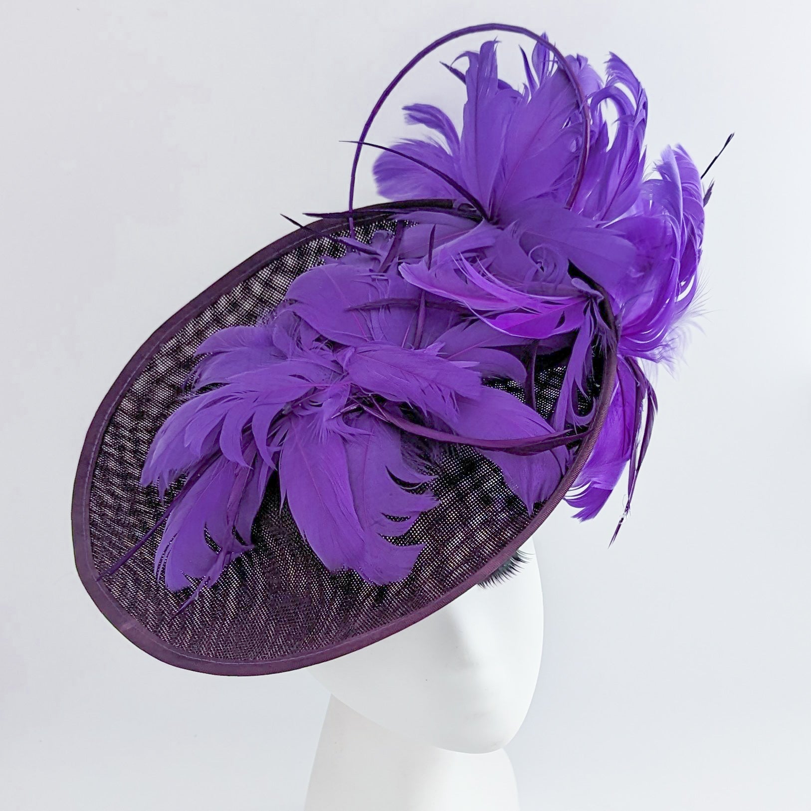 Dark plum cadbury purple large feather saucer disc fascinator hat