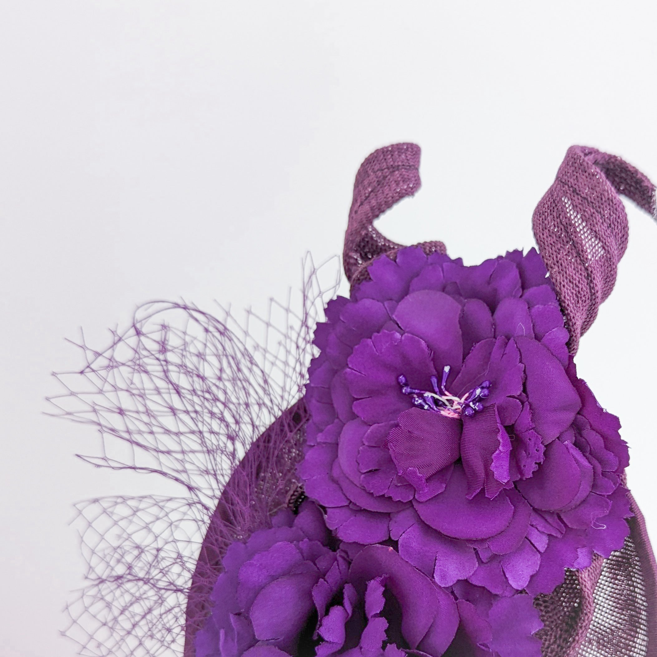 Dark plum purple flower fascinator disc saucer hat