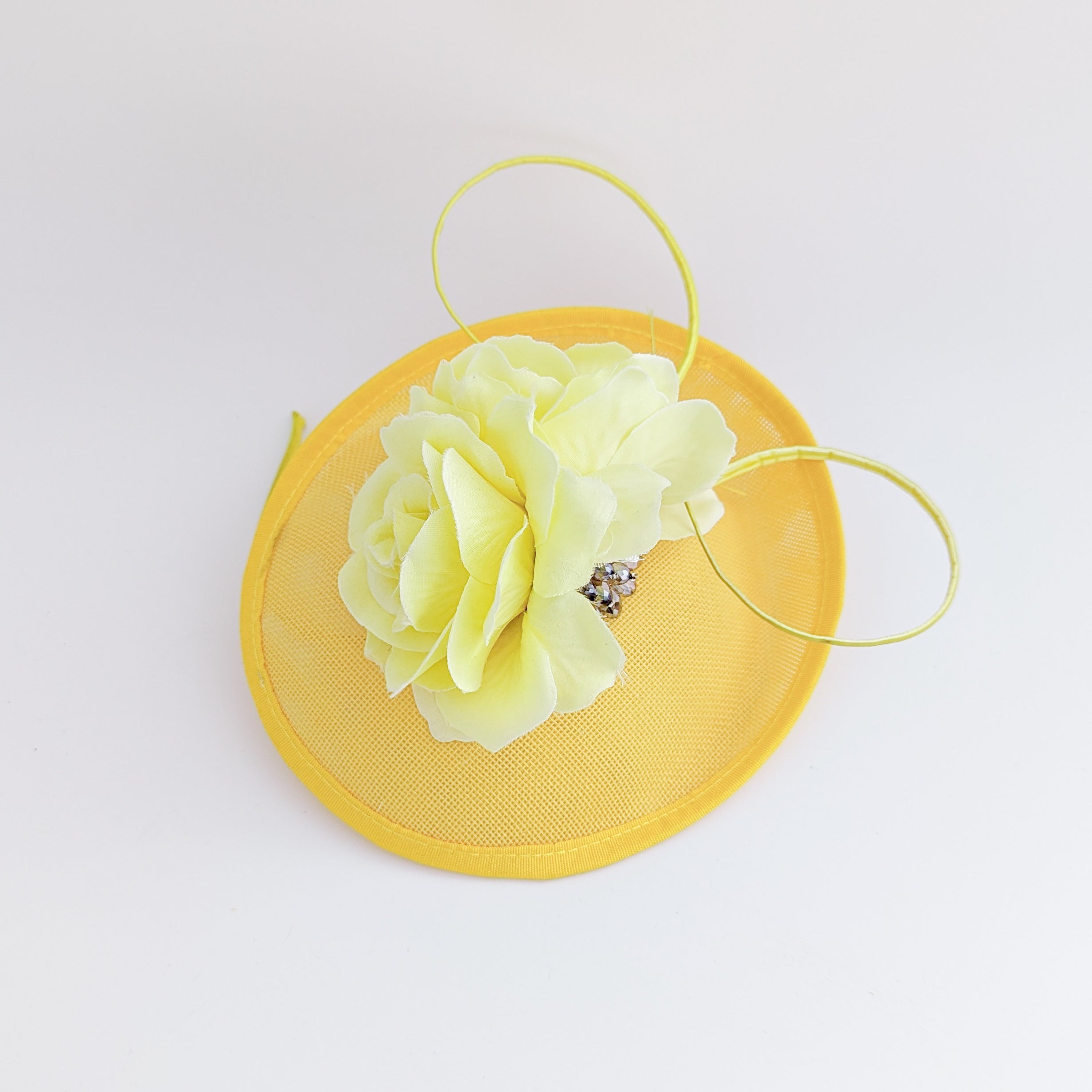 Yellow flower disc saucer fascinator hat