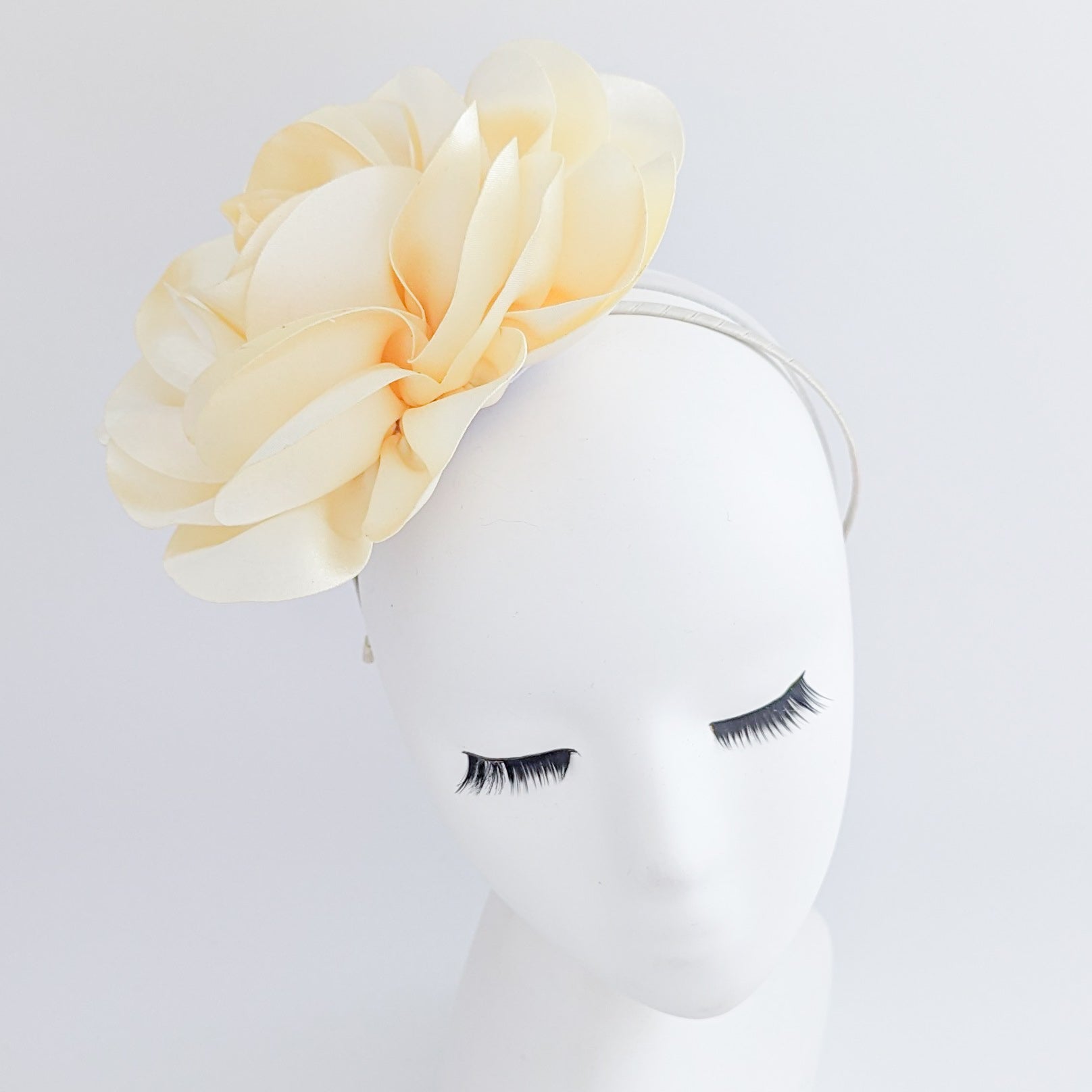 Large cream satin rose fascinator hat Large cream satin rose fascinator hat