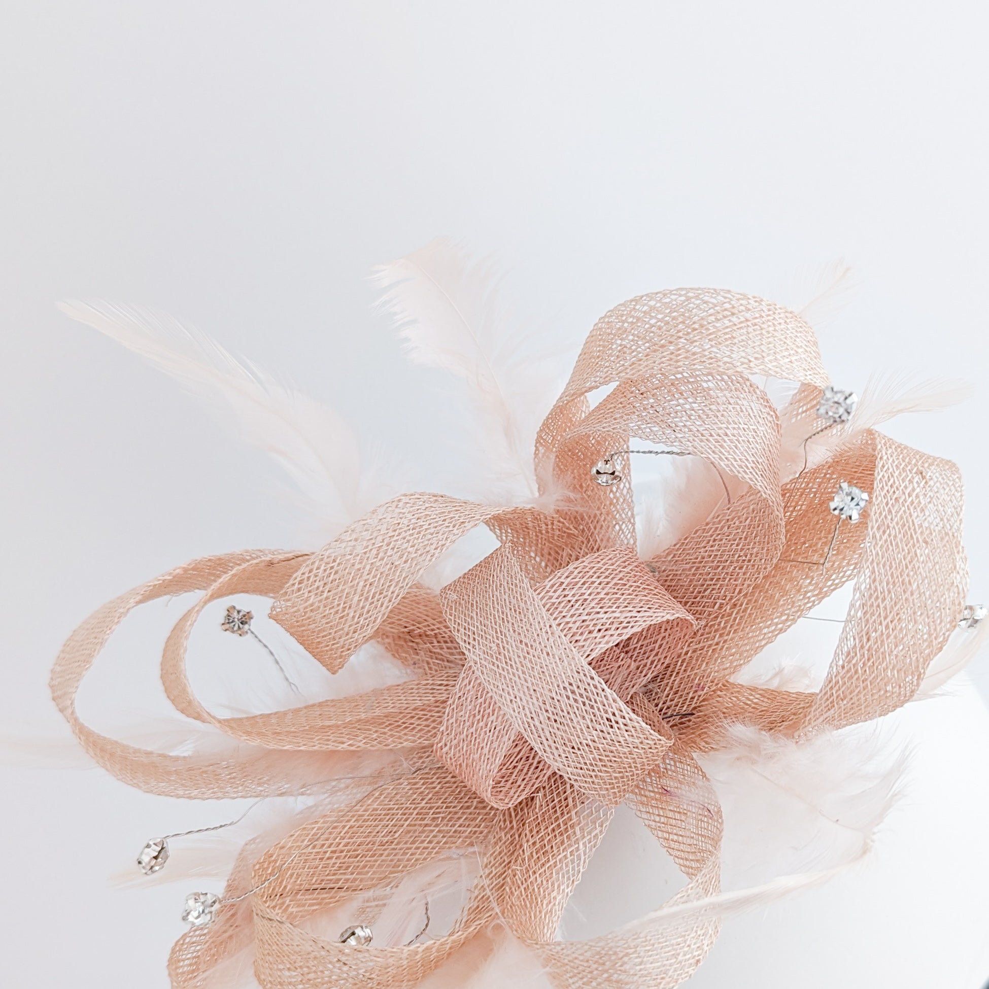 Light peach pink crystal feather fascinator hat