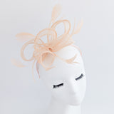 Light peach feather fascinator hat Light peach feather fascinator hat