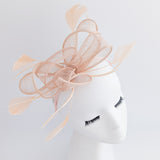 Light peach pink feather fascinator hat