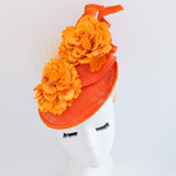 Orange flower fascinator disc saucer hat Orange flower fascinator disc saucer hat