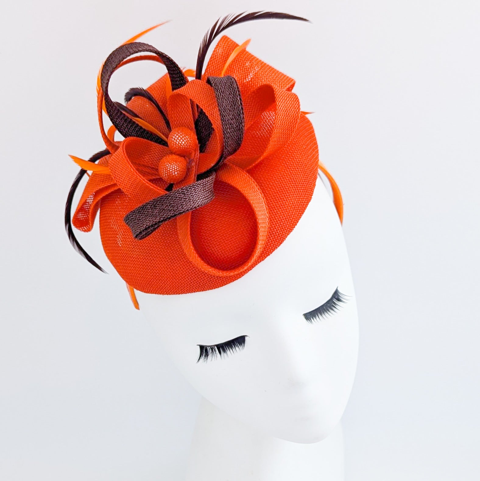 Orange brown feather fascinator disc saucer hat Orange brown feather fascinator disc saucer hat