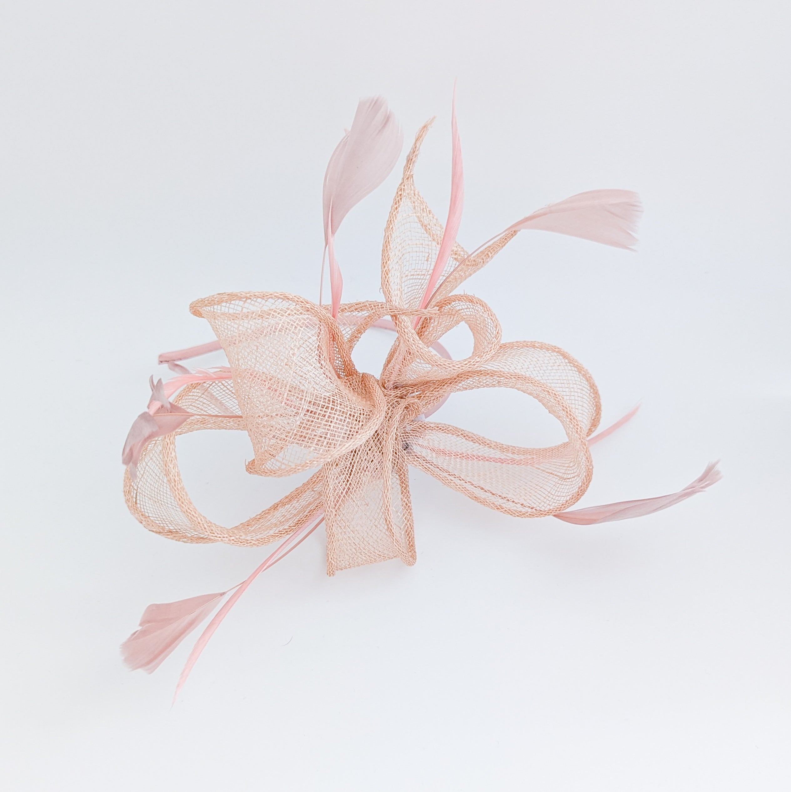 Light peach pink feather fascinator hat Light peach pink feather fascinator hat