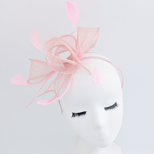 Light peach pink feather fascinator hat