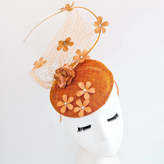 Burnt orange flower fascinator hat House of Hats