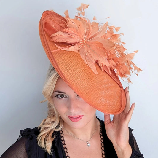 Terracotta dusty orange large feather oval disc fascinator hat House of Hats