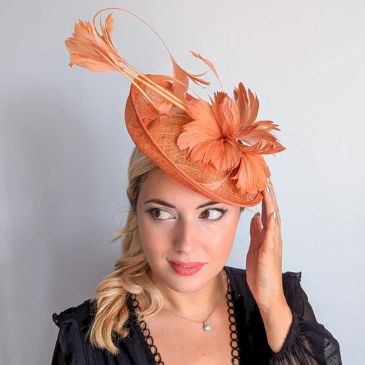 Dusty terracotta orange feather disc fascinator hat House of Hats