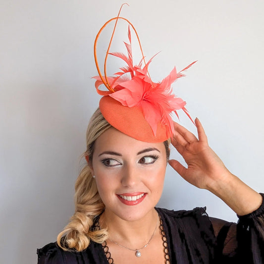 Coral orange feather fascinator hat House of Hats