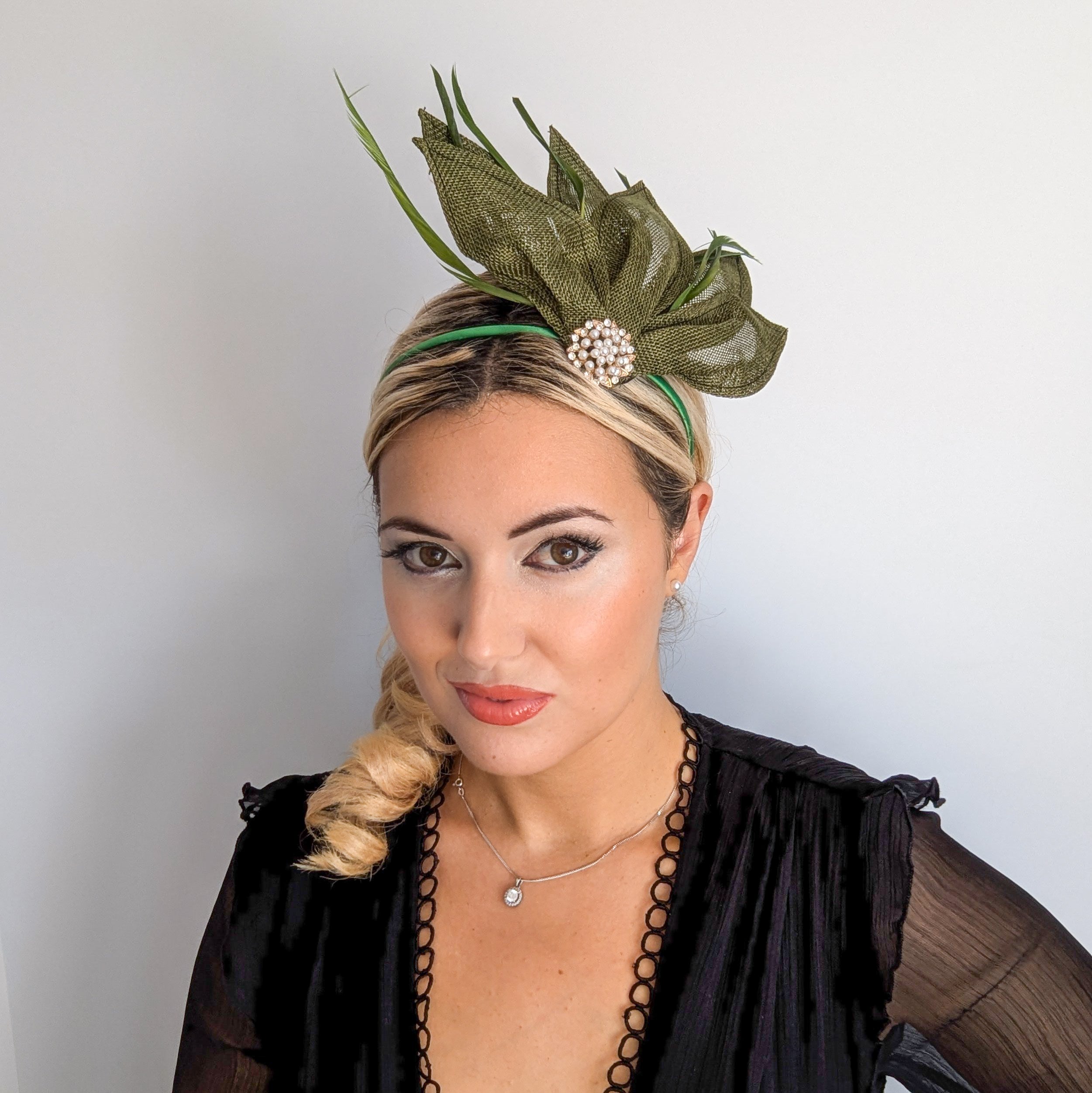 Moss green feather petal fan fascinator hat Moss green feather petal fan fascinator hat