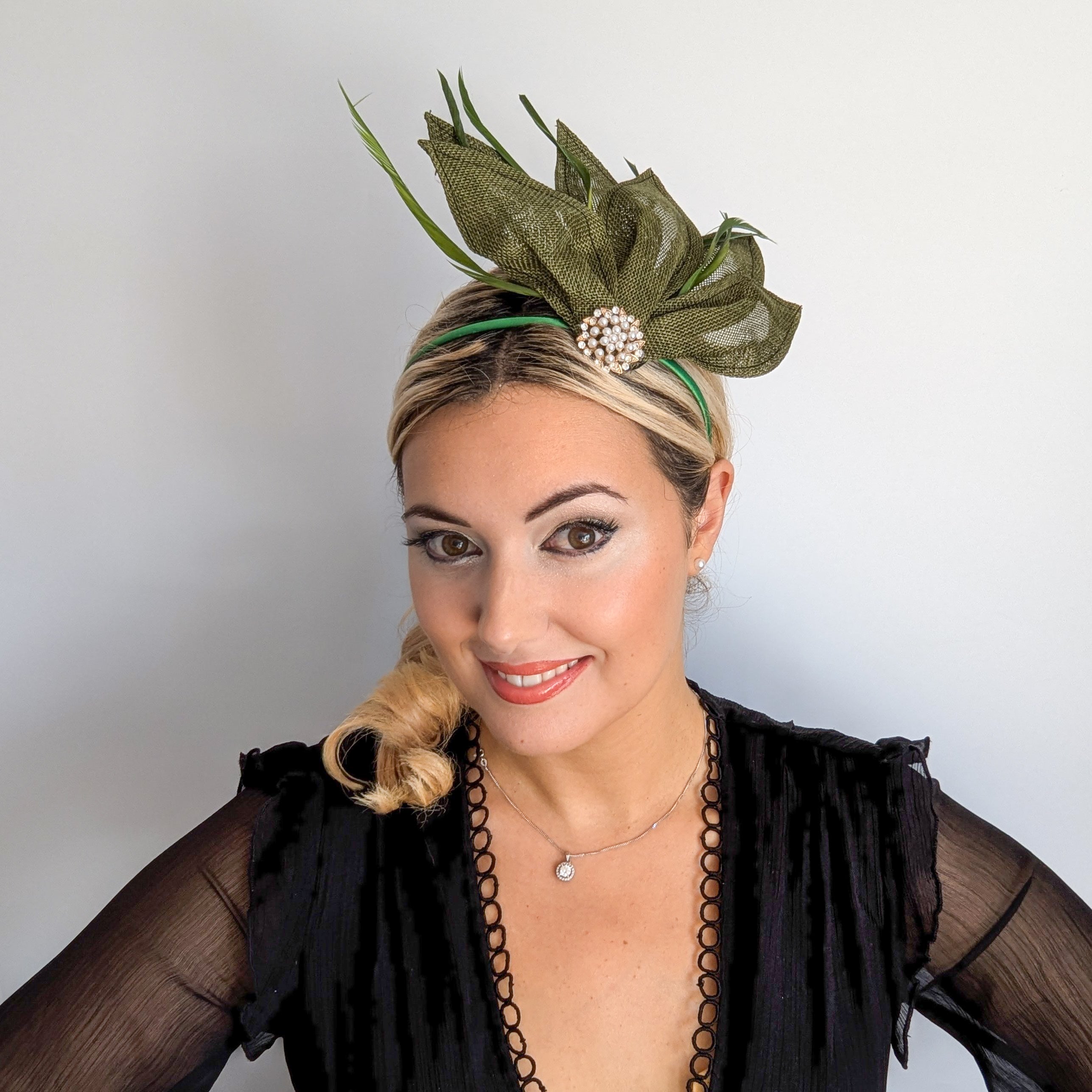 Moss green feather petal fan fascinator hat Moss green feather petal fan fascinator hat