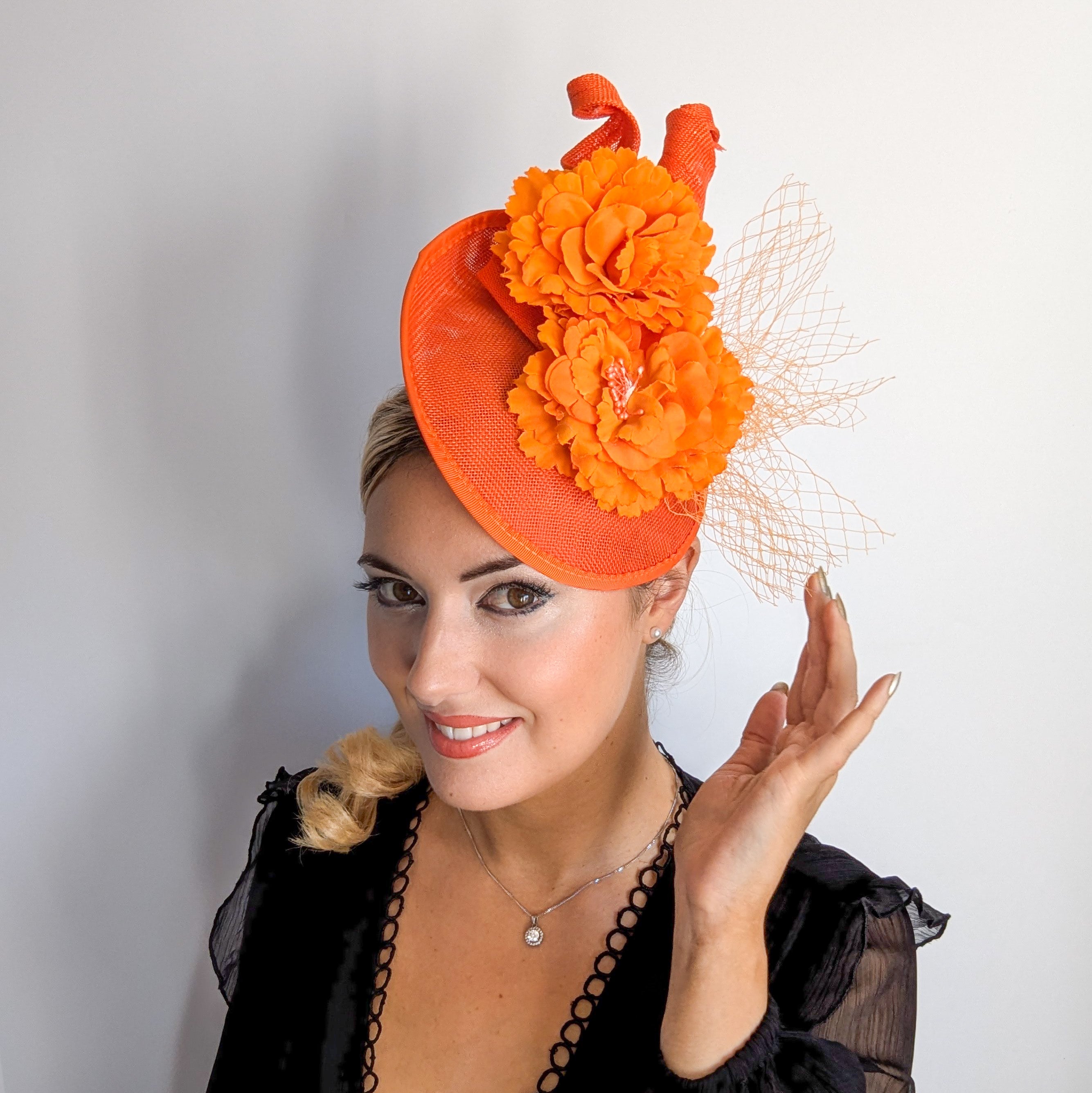 Orange flower fascinator disc saucer hat Orange flower fascinator disc saucer hat